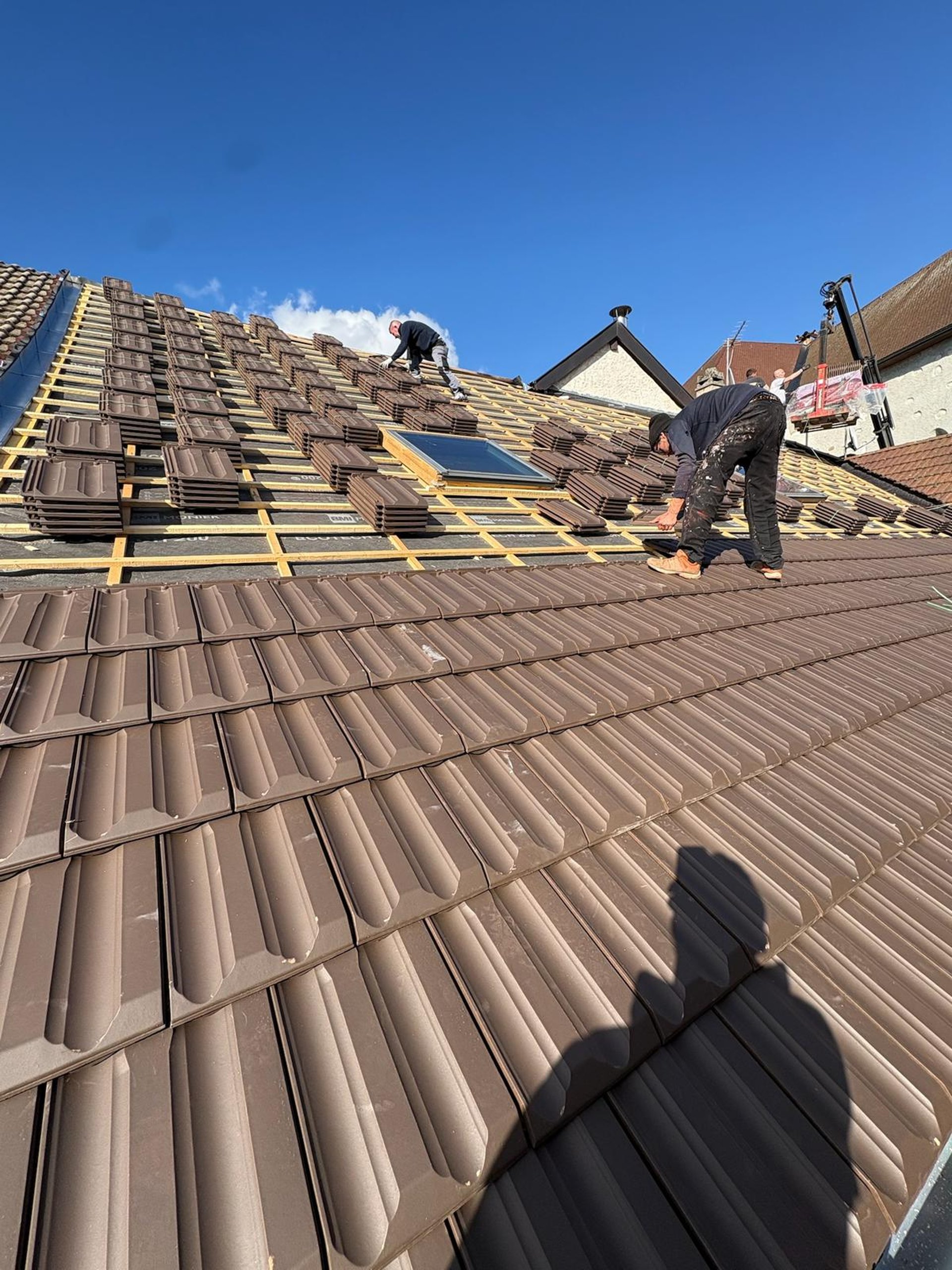 a couple of people that are on a roof