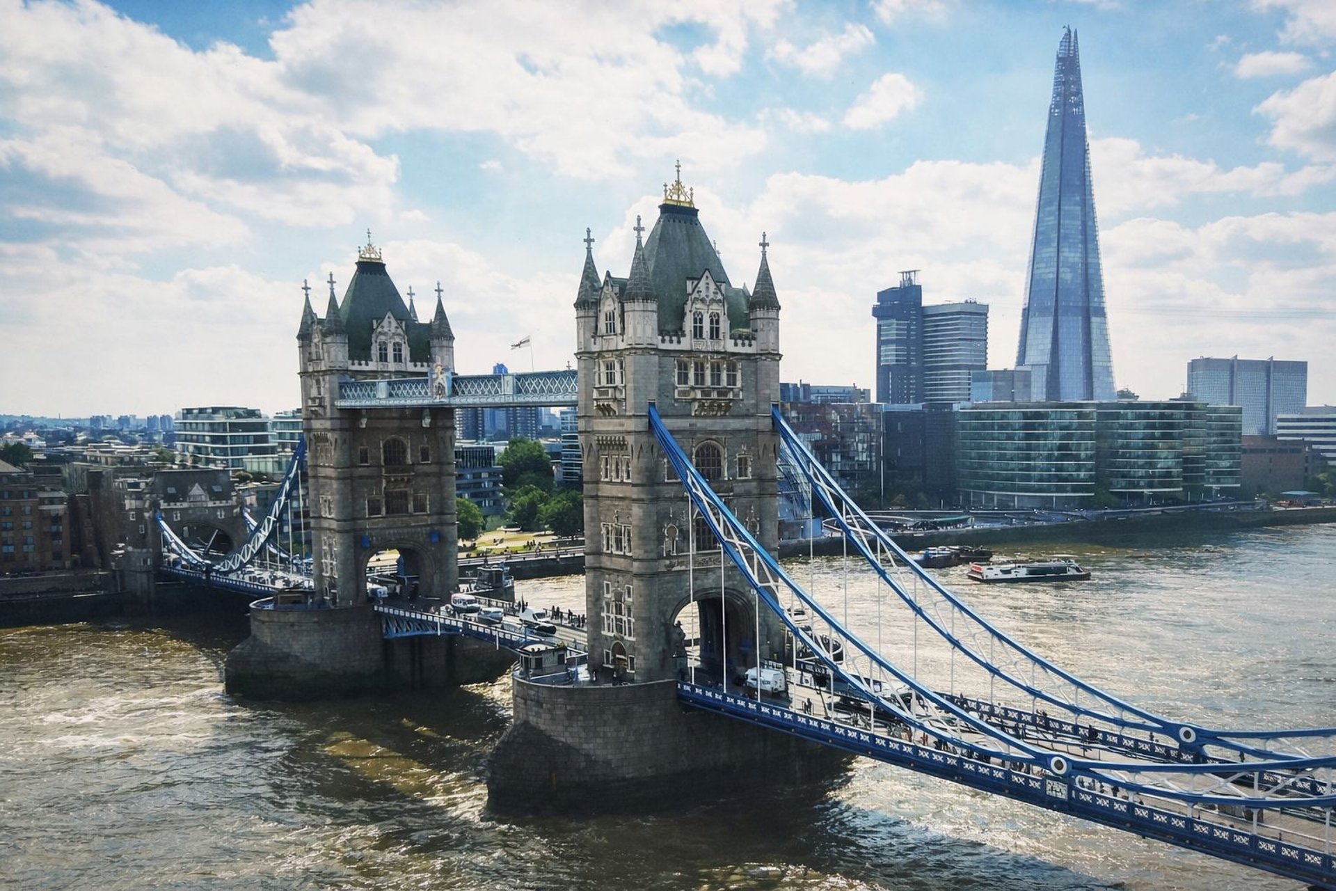 an abstract photo of a curved building with a blue sky in the background