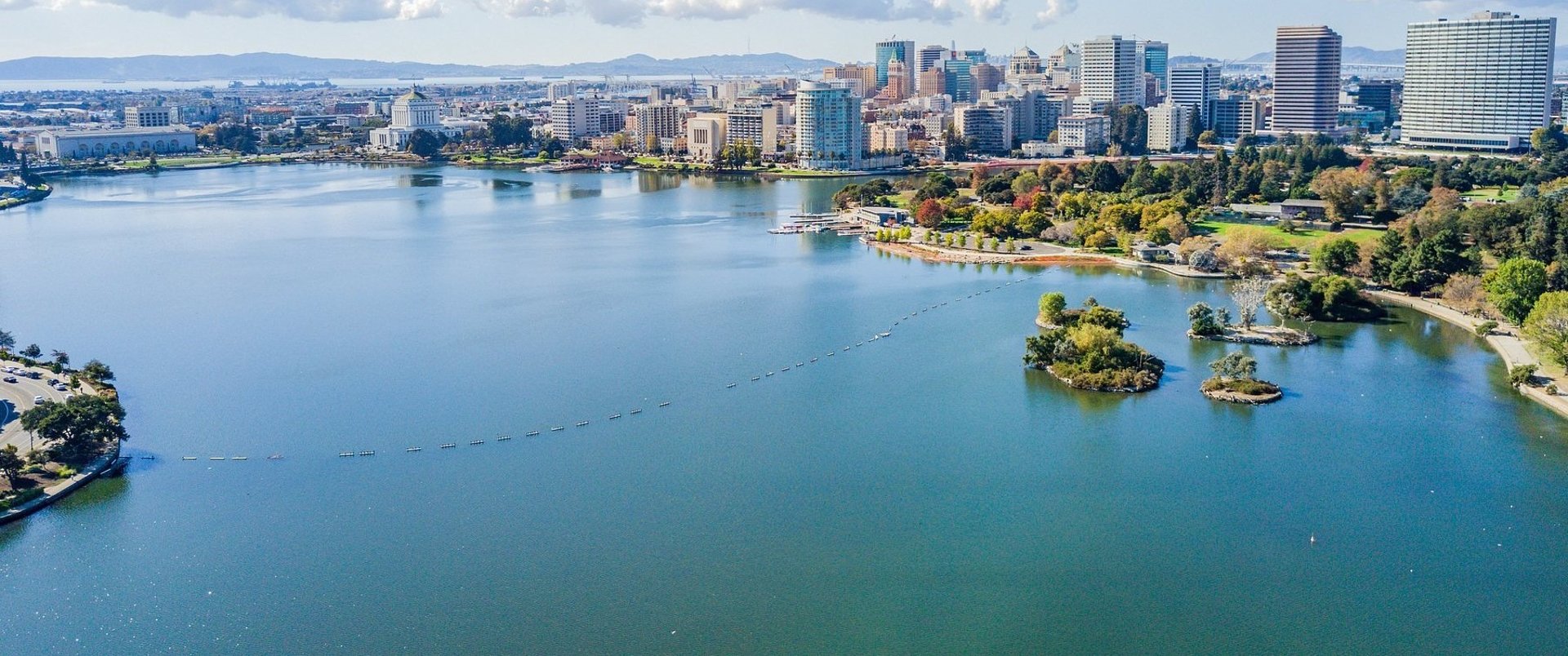 an abstract photo of a curved building with a blue sky in the background