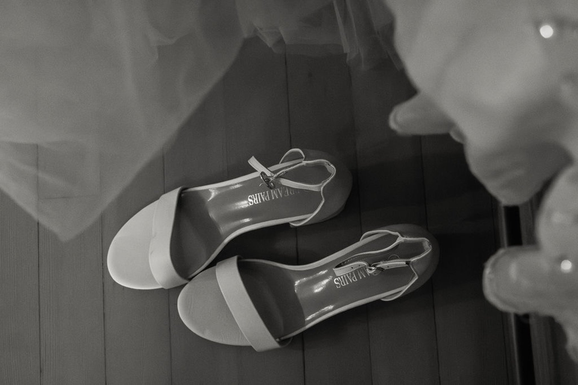 black and white detail shot of bride's shoes