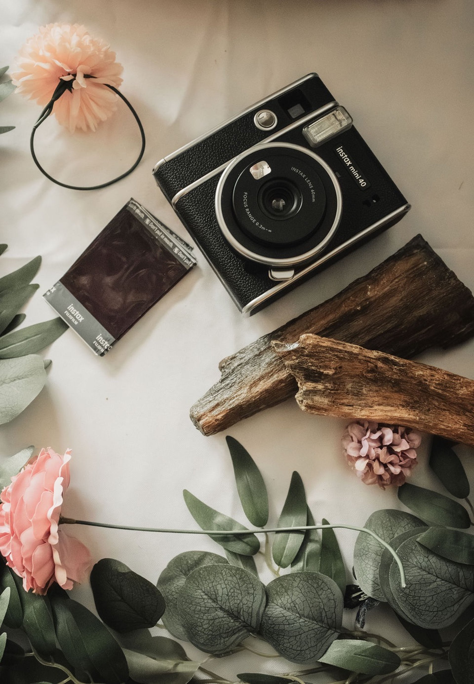 flat lay of wedding details, film polaroid camera