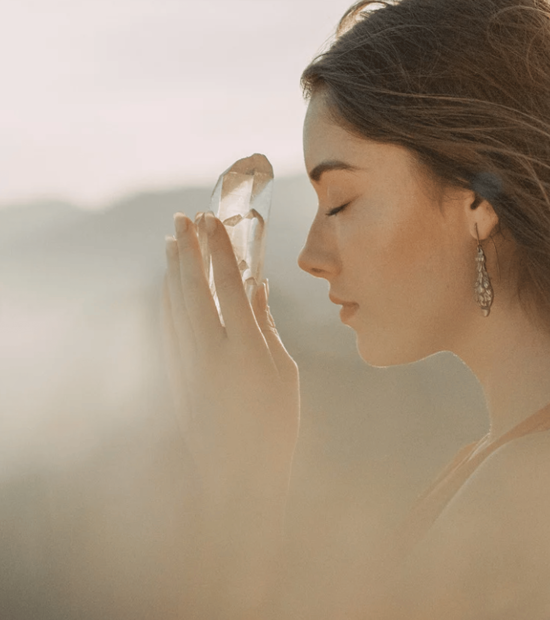woman holding silver-colored crown