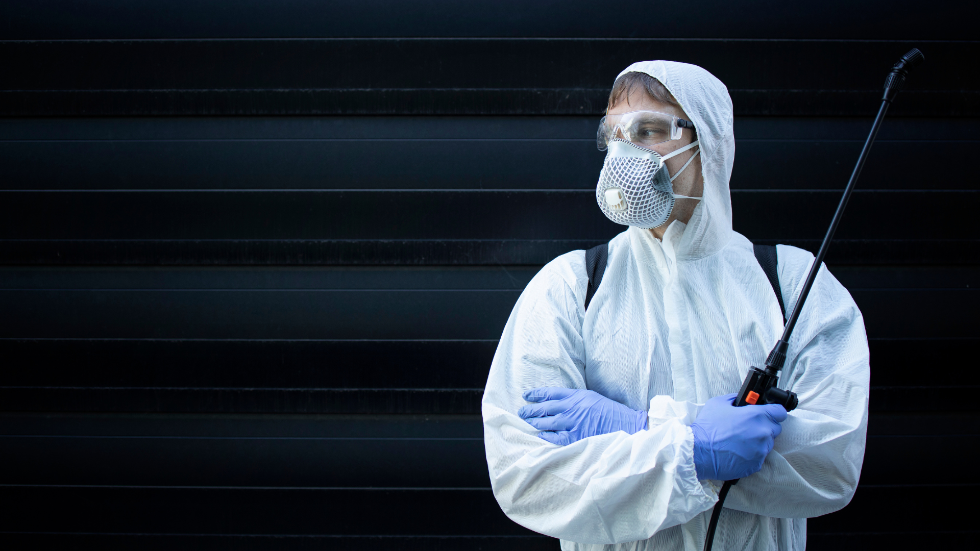 a man wearing full coverall for disinfection