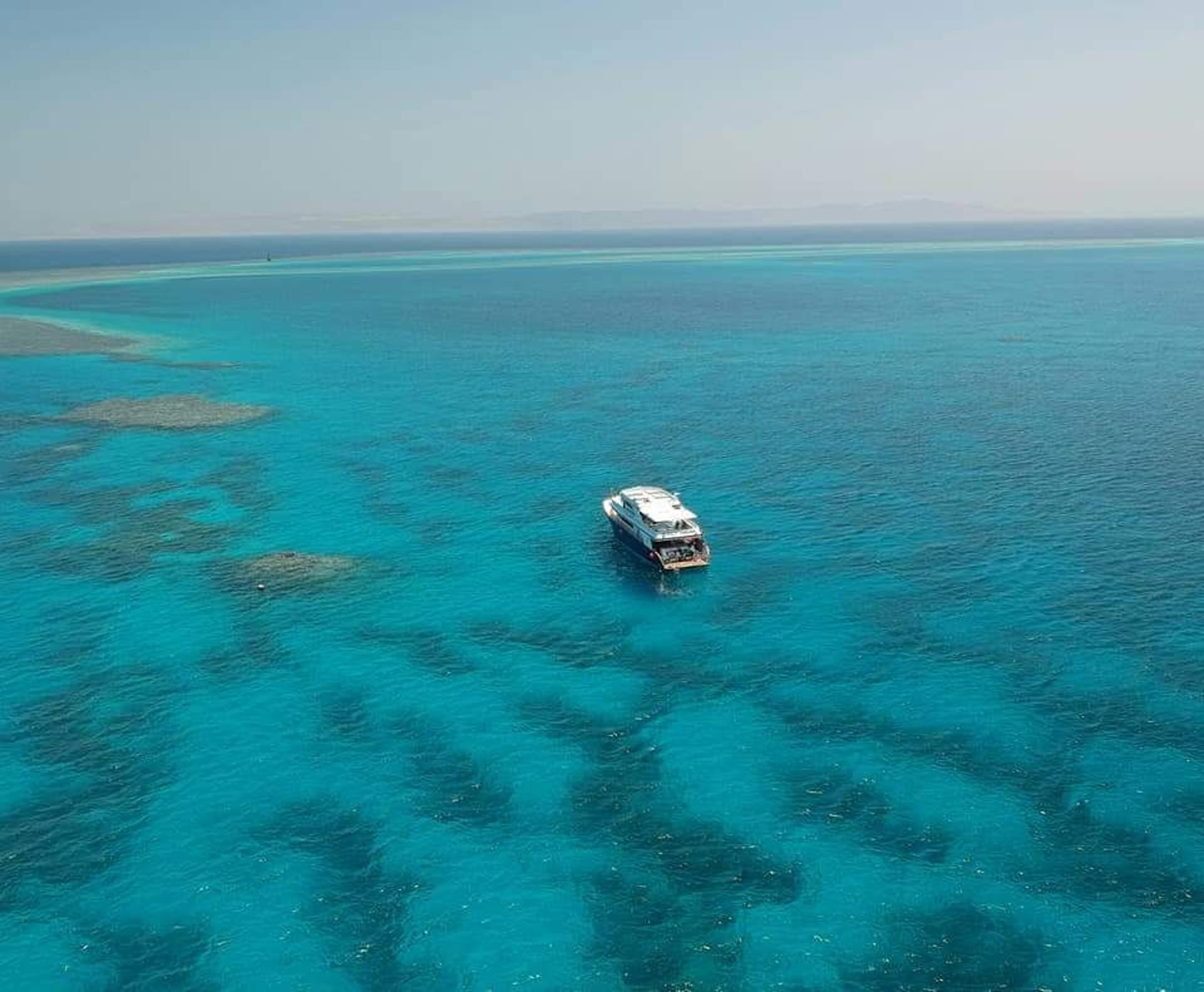 woman wearing yellow long-sleeved dress under white clouds and blue sky during daytime