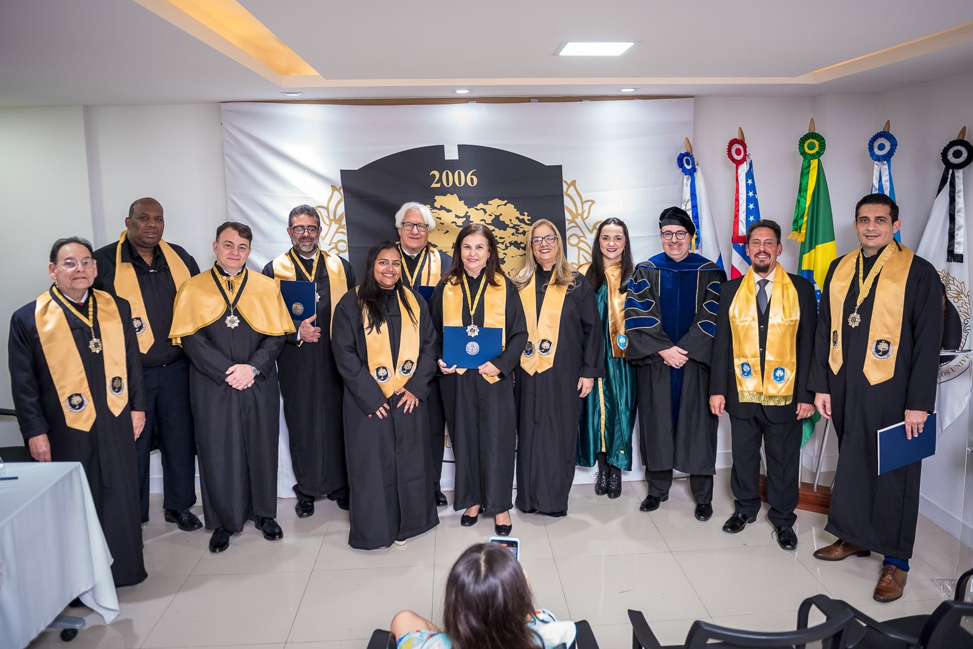 a group of women walking down a sidewalk next to bicycles