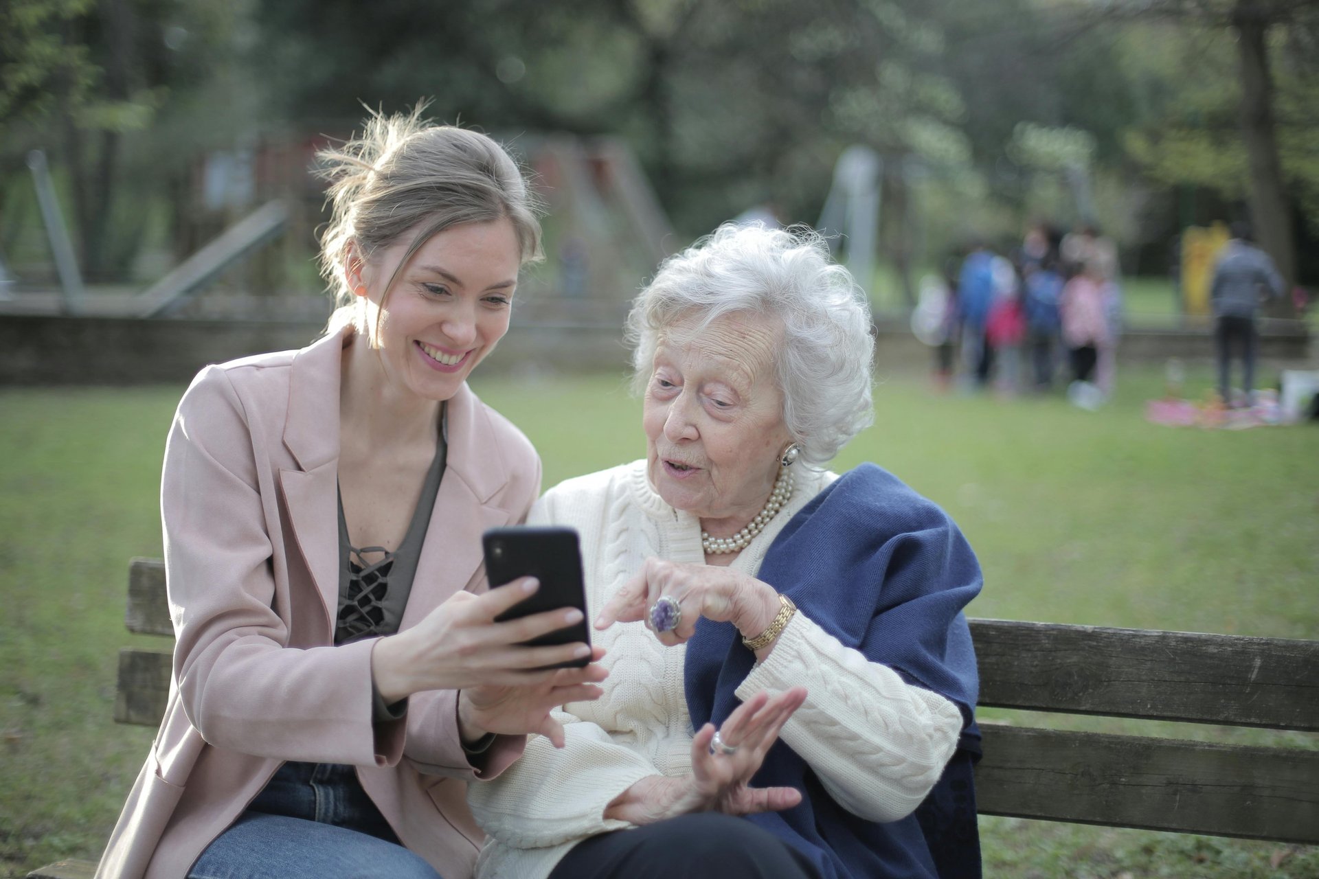 woman in maroon sweater using laptop