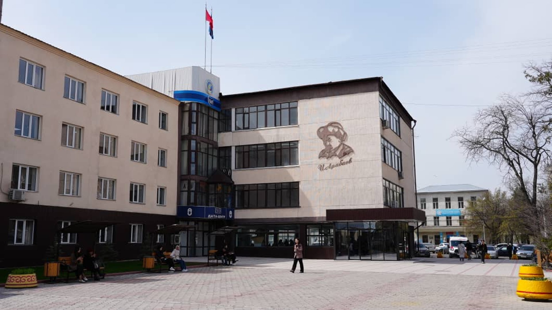 a tall building with red and white squares on it