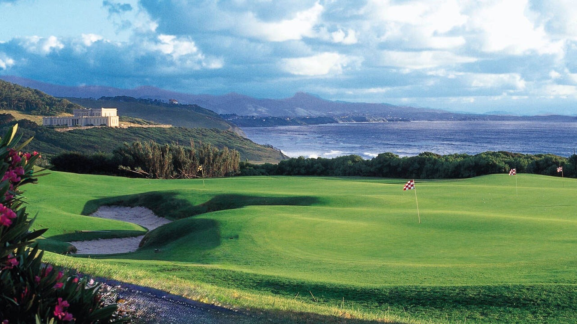 A person hitting a golf ball with a golf club