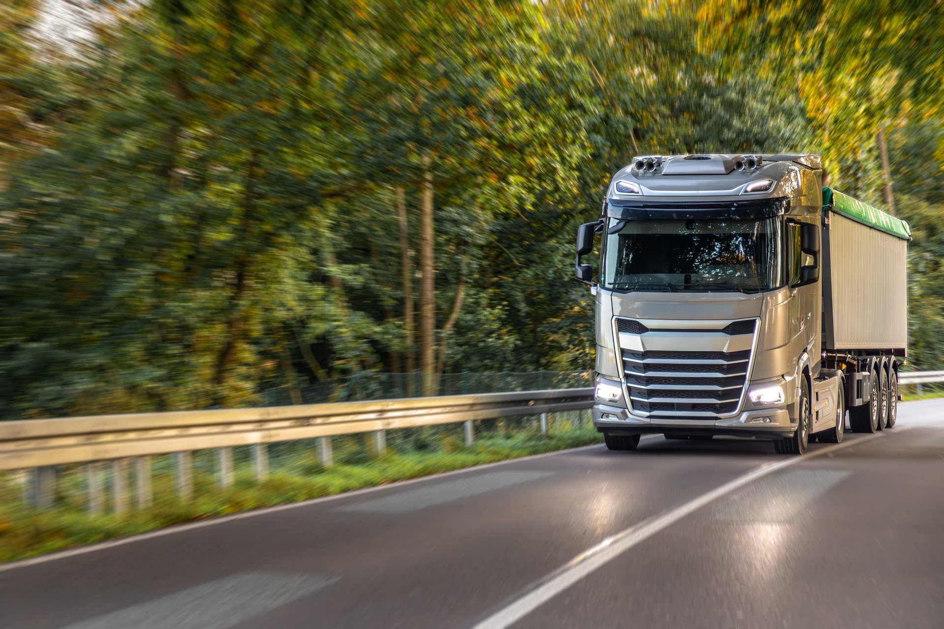 white and black storage truck on gray asphalt road