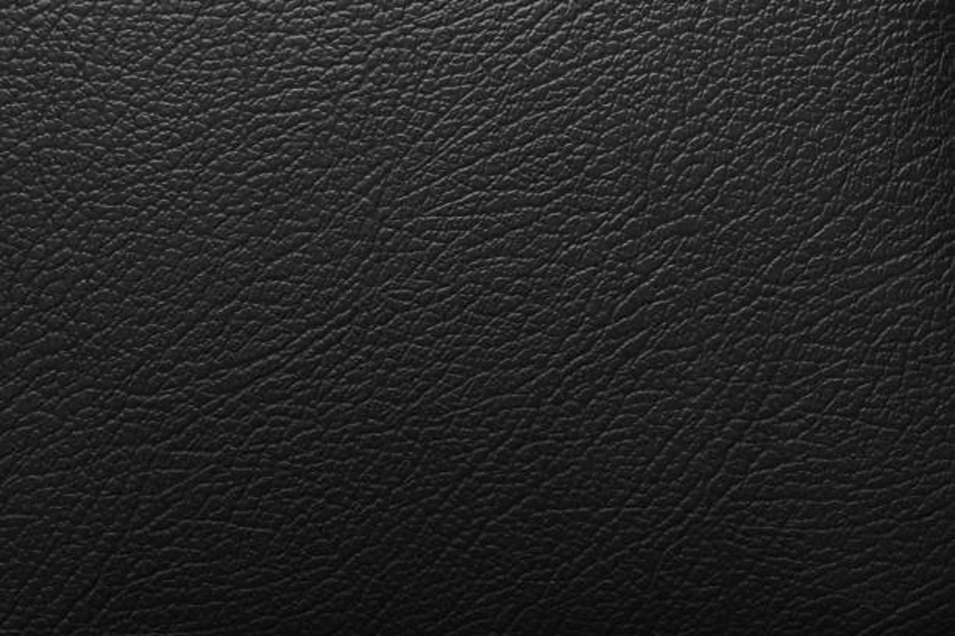 black and brown leather padded tub sofa