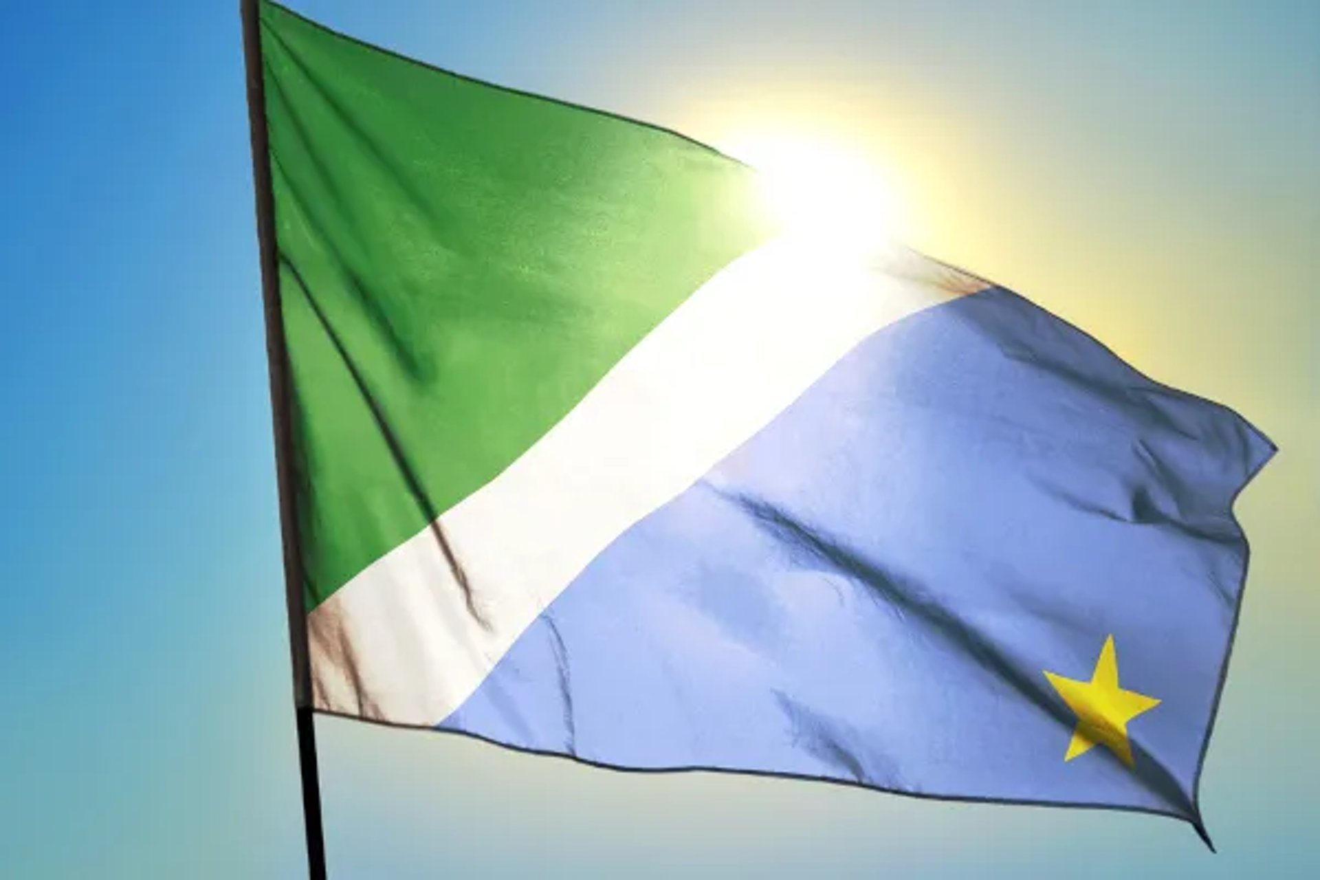 an abstract photo of a curved building with a blue sky in the background