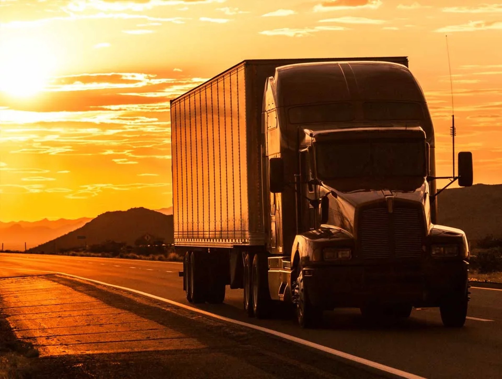 white freight truck on road during daytime