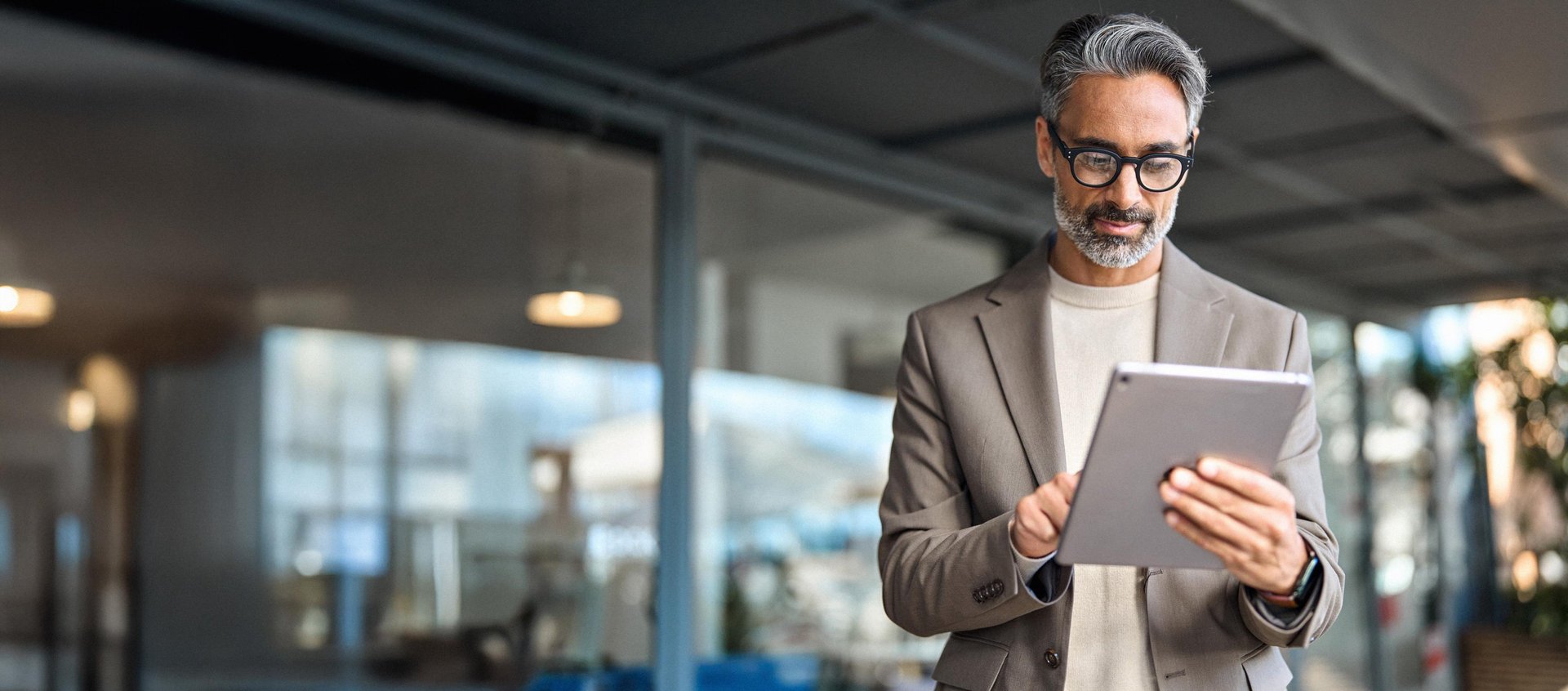 an abstract photo of a curved building with a blue sky in the background