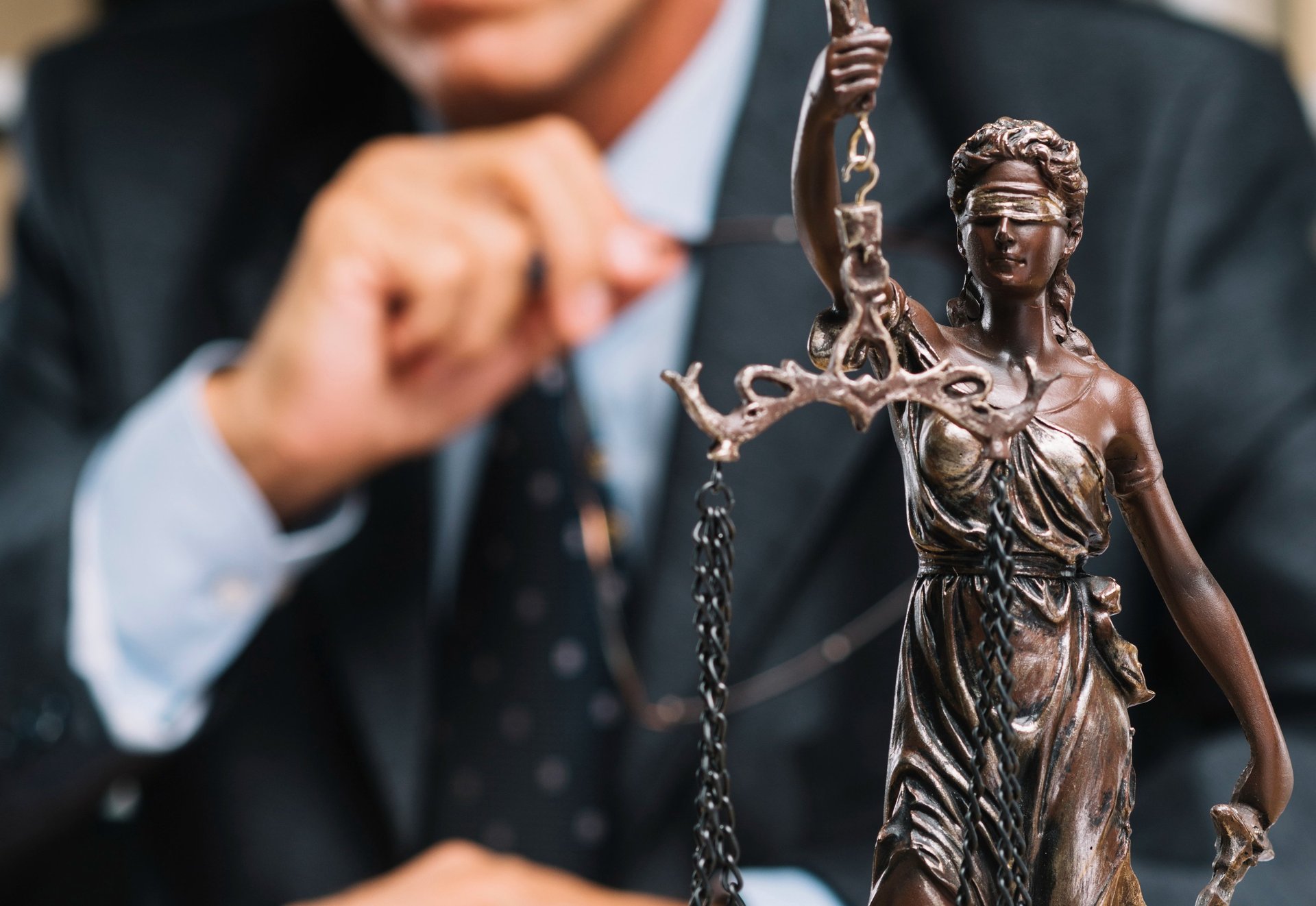 an airplane flying in front of a very tall building