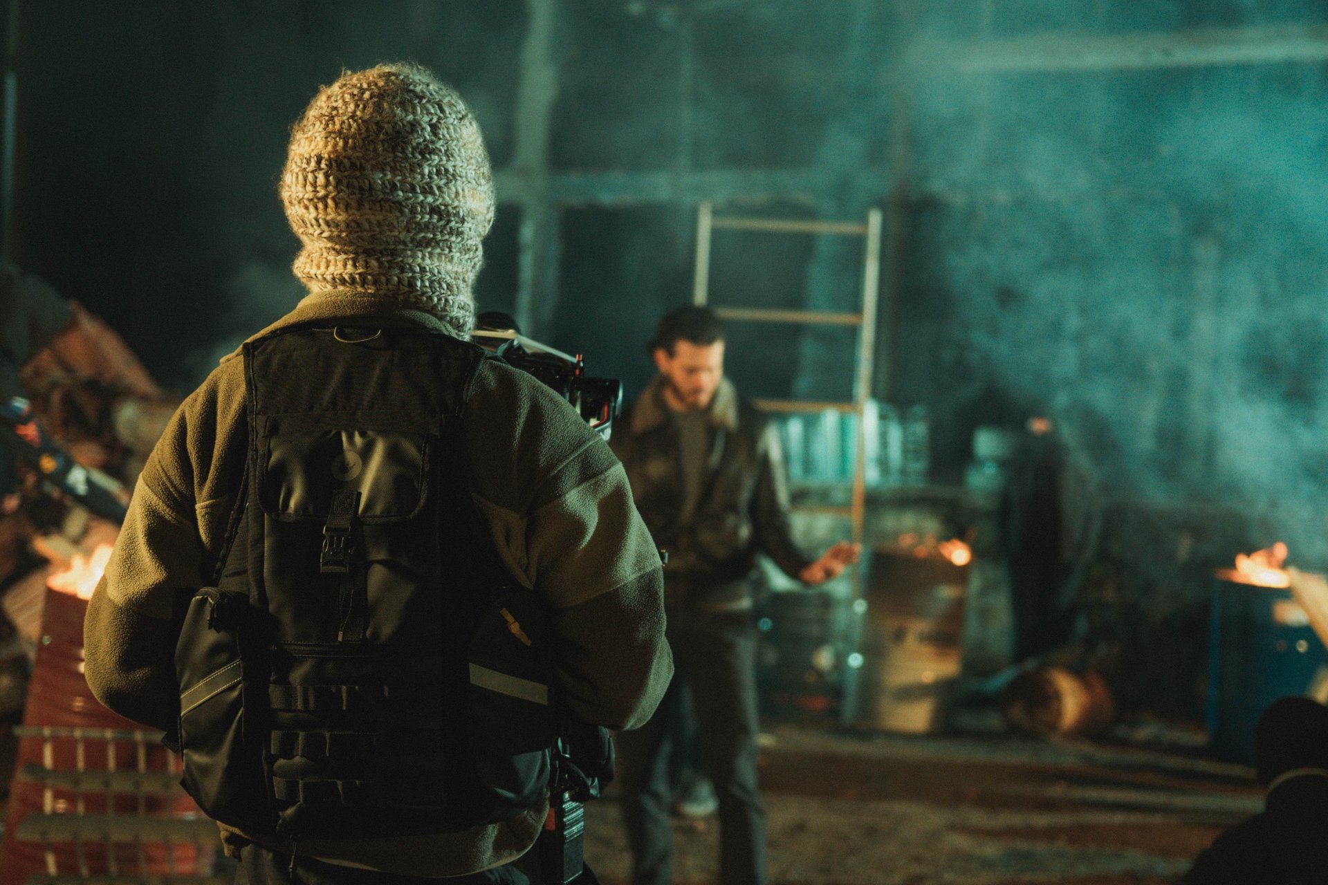 an abstract photo of a curved building with a blue sky in the background