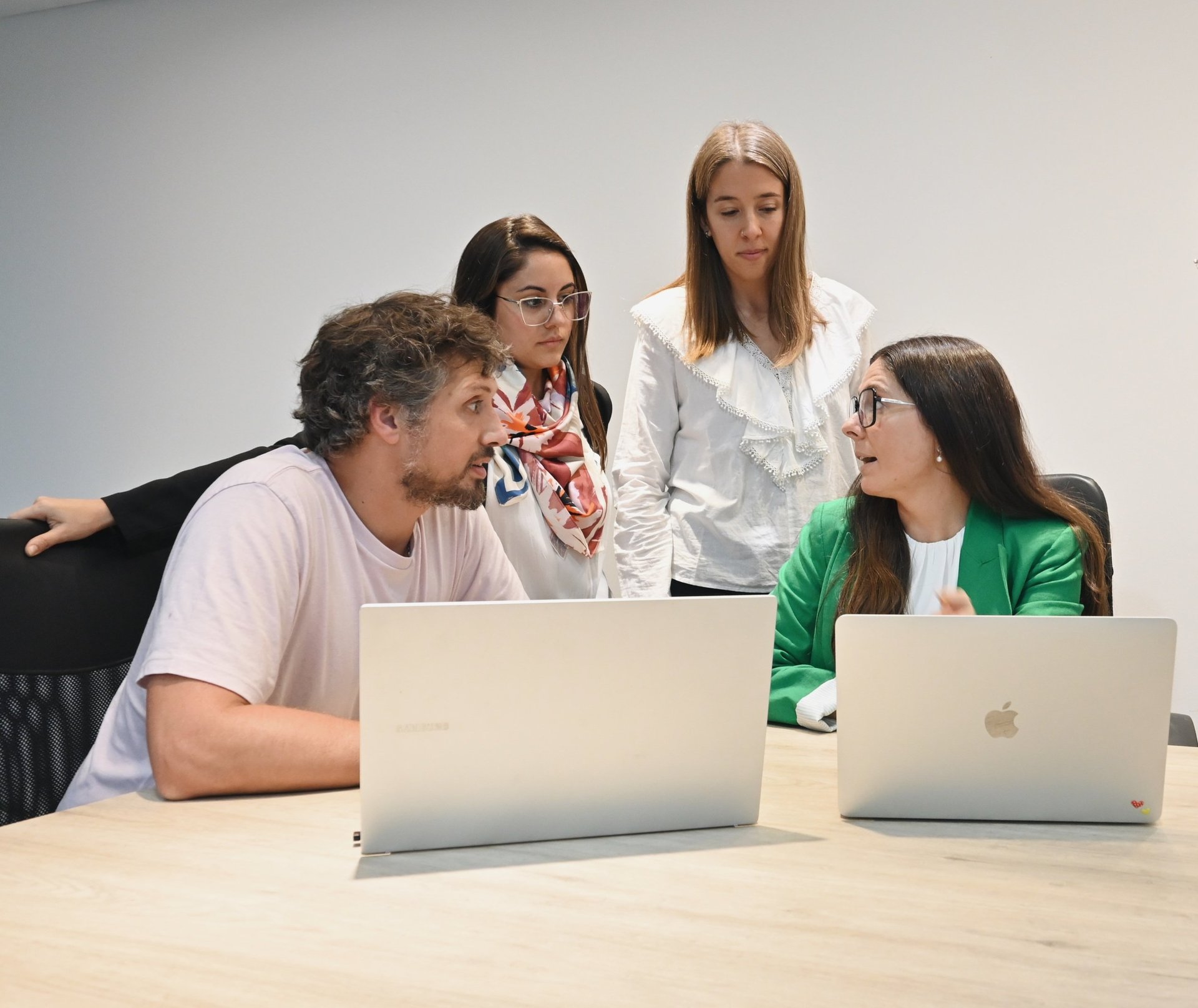 group of people using laptop computer
