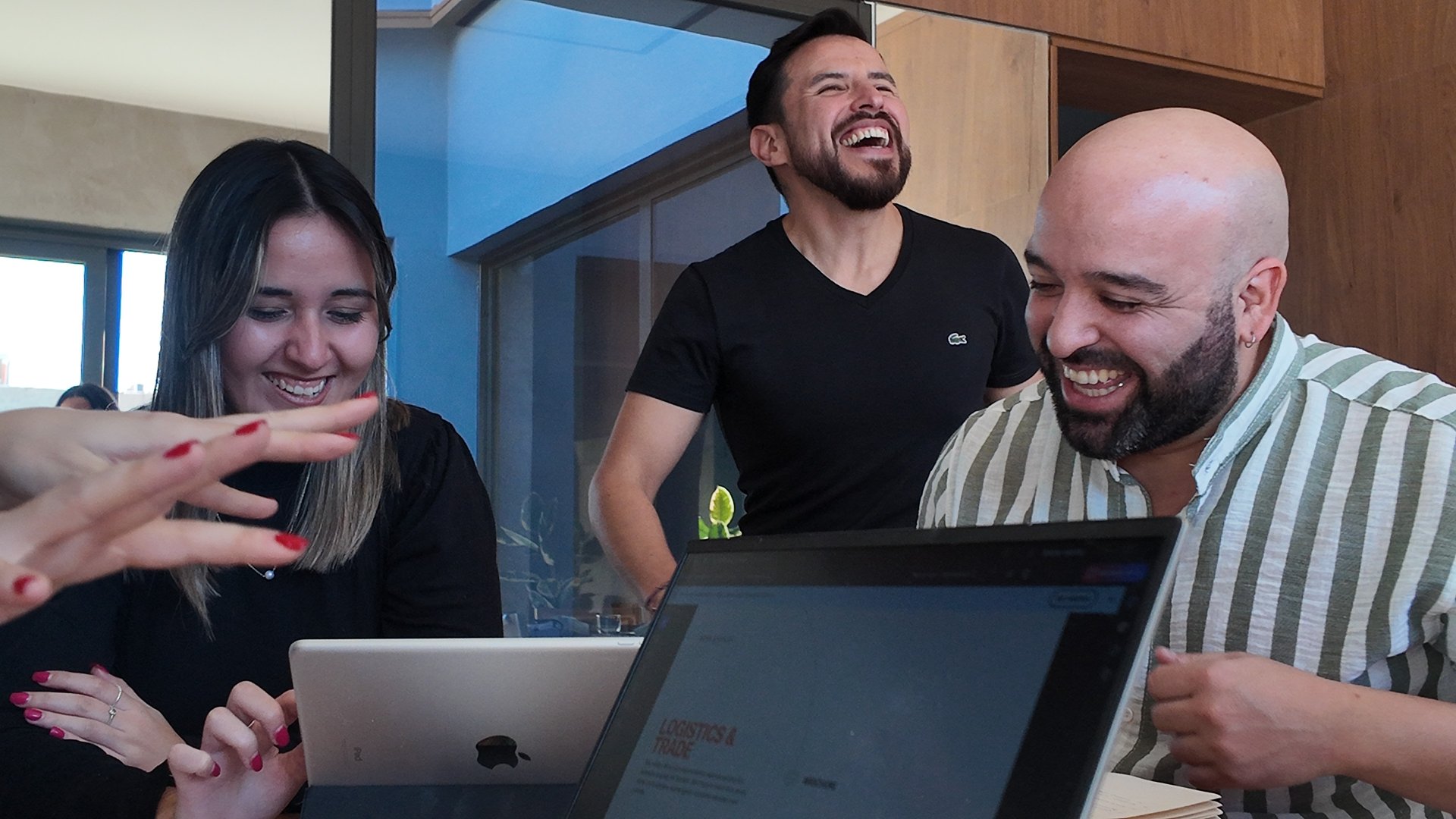 person touching and pointing MacBook Pro