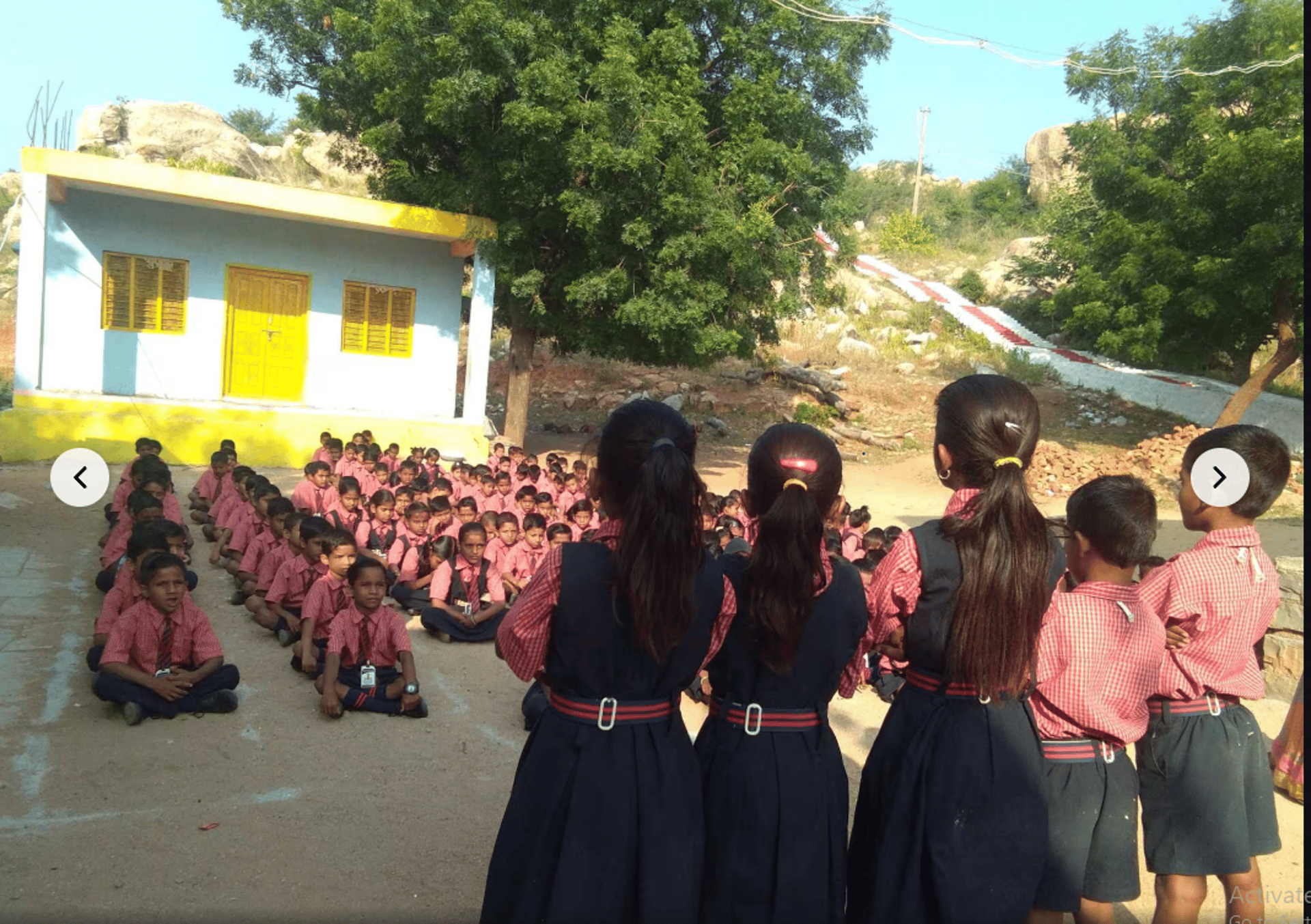 A group of children sitting at desks in a classroom