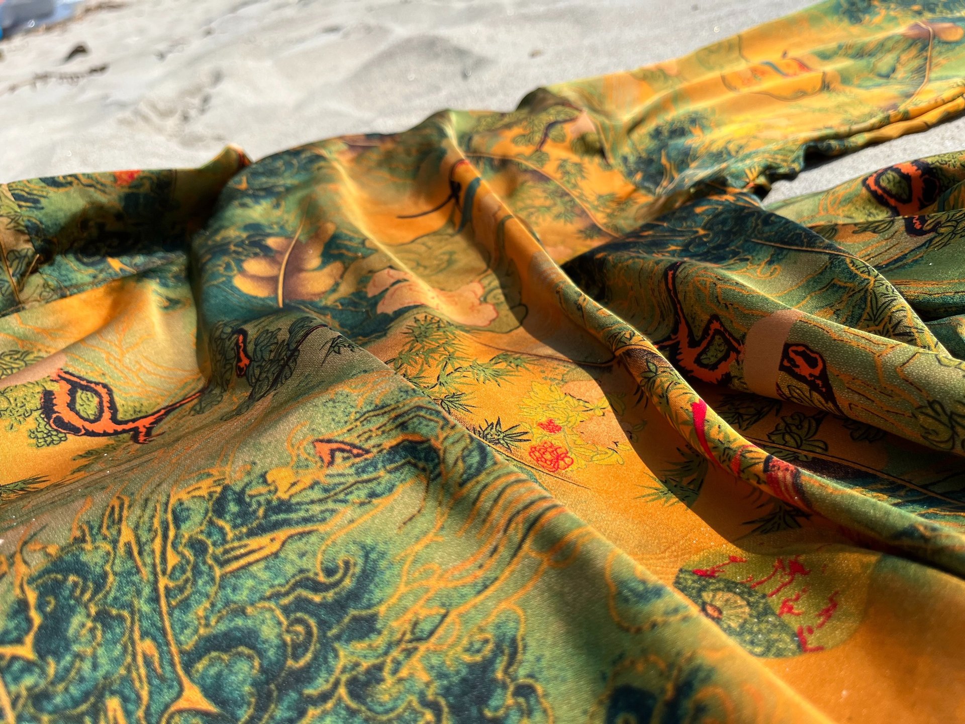 woman wearing yellow long-sleeved dress under white clouds and blue sky during daytime