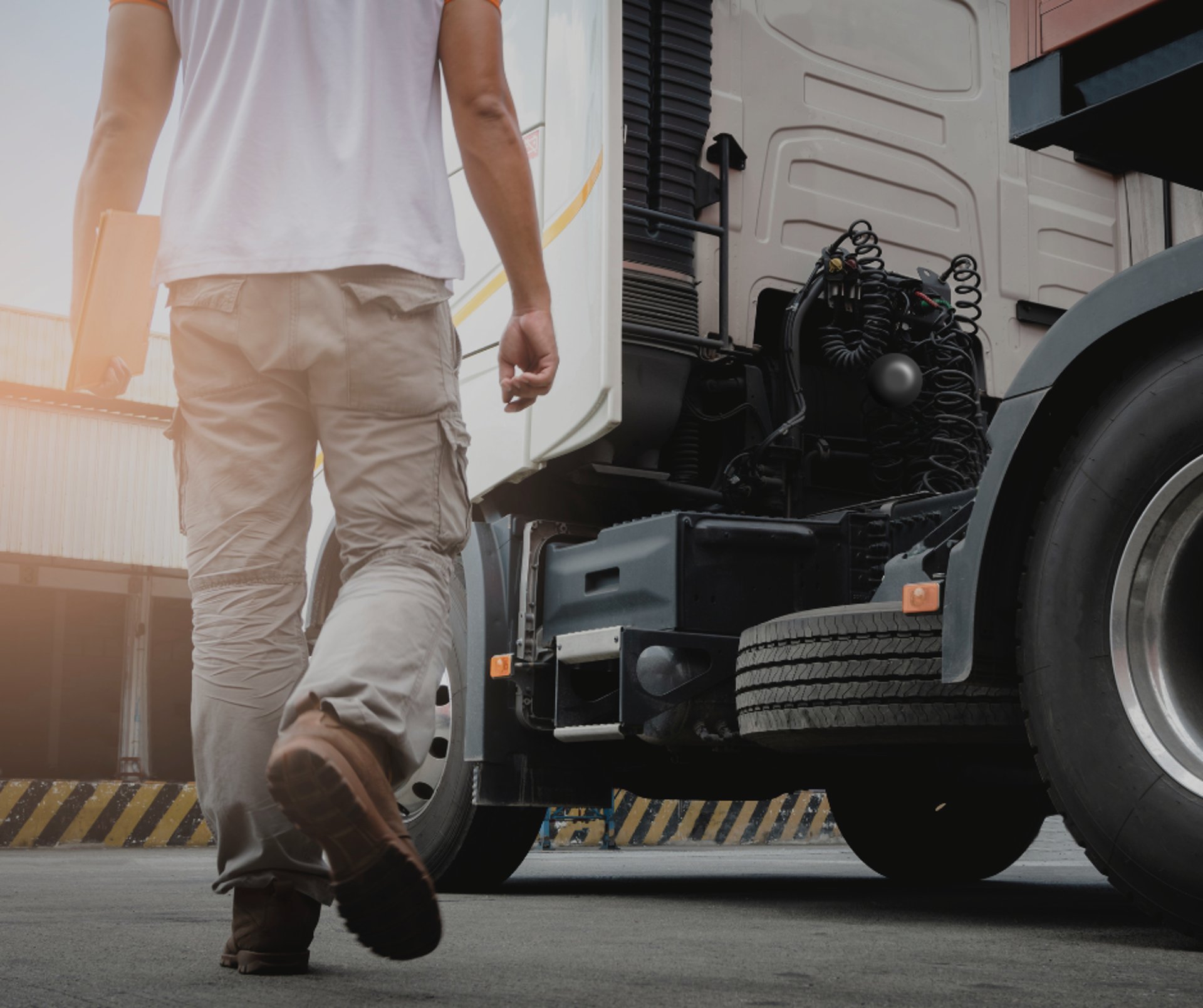 grayscale photo of person walking on beach