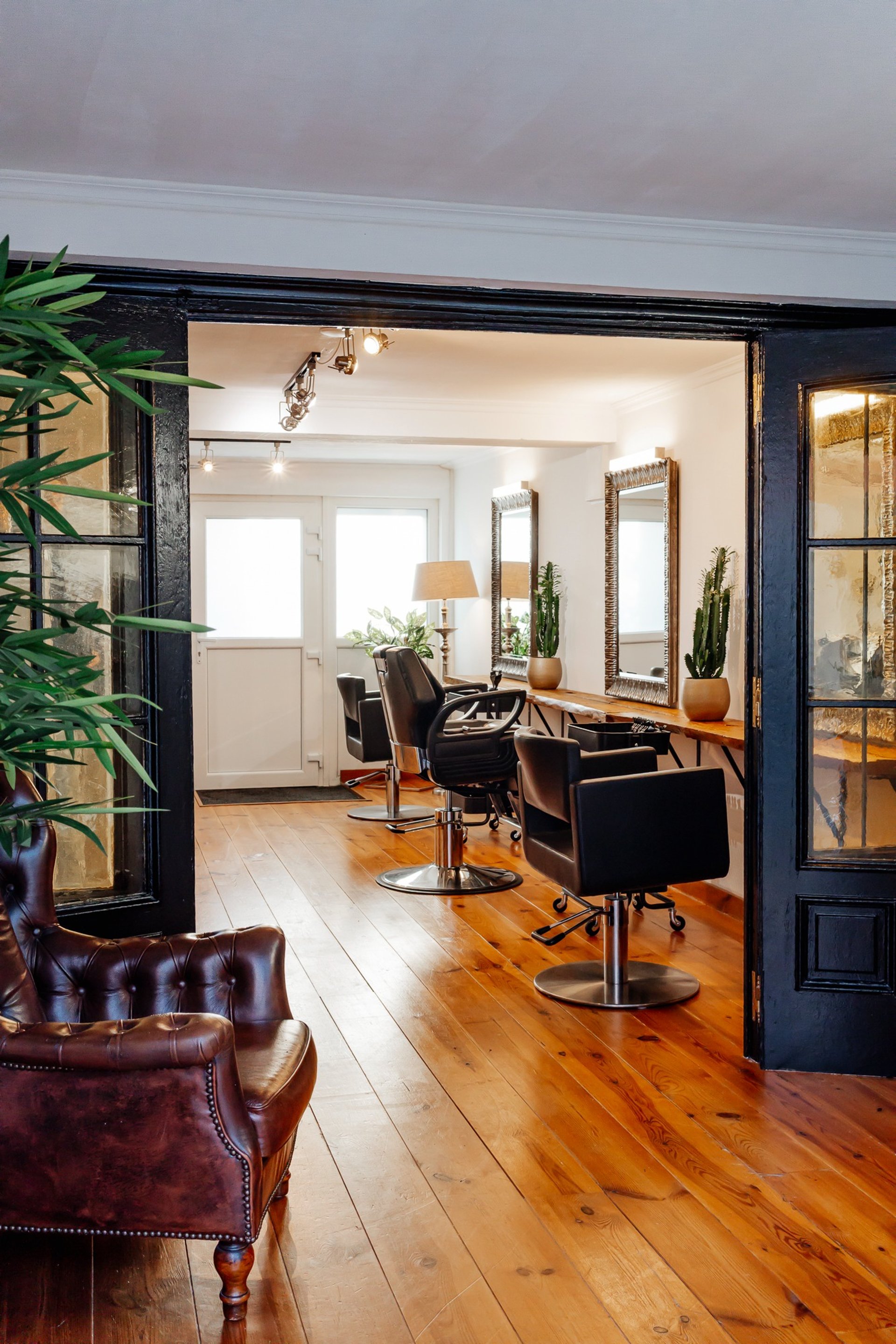 black and brown leather padded tub sofa