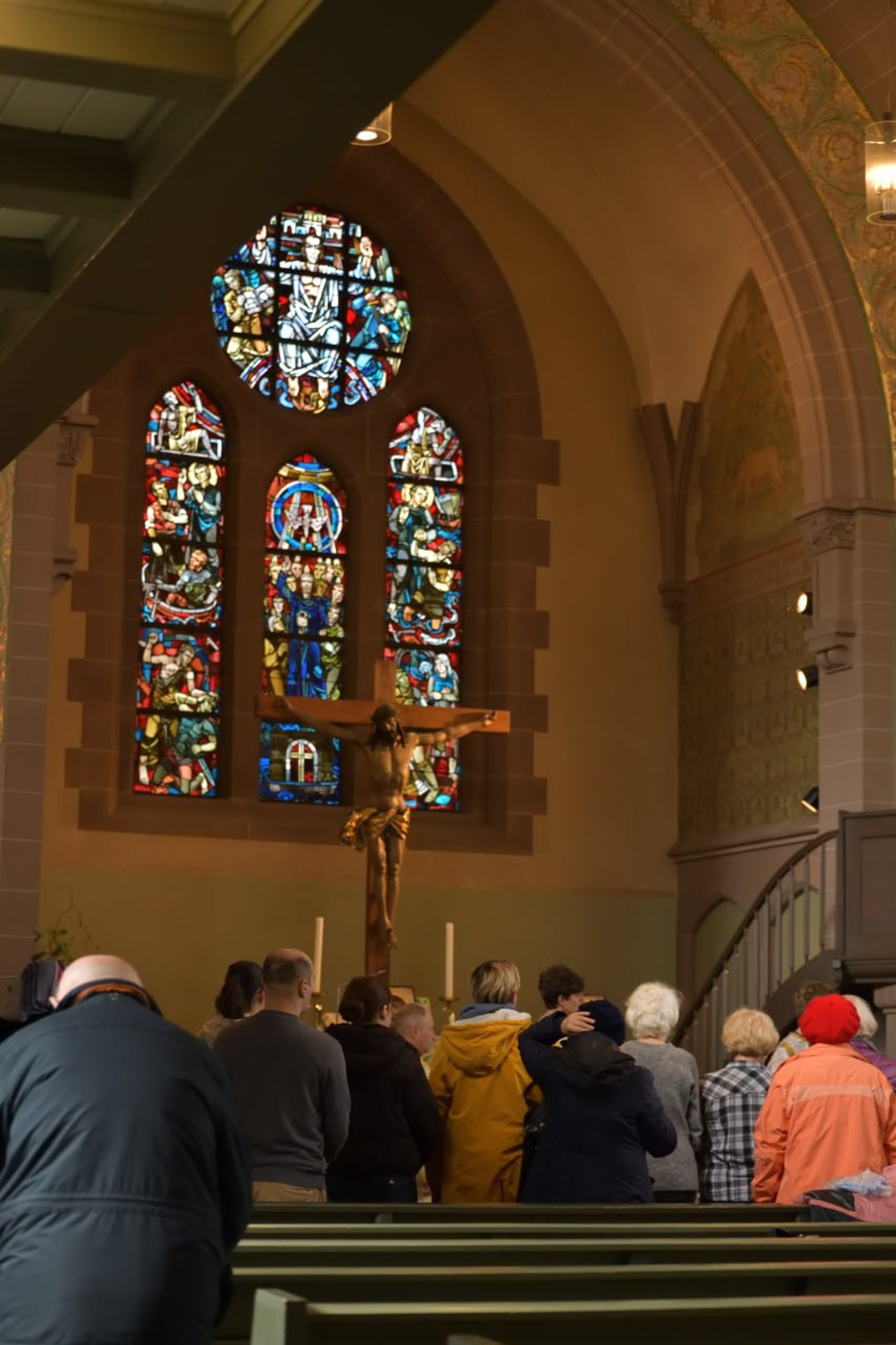 a group of sheep walk down a dirt road