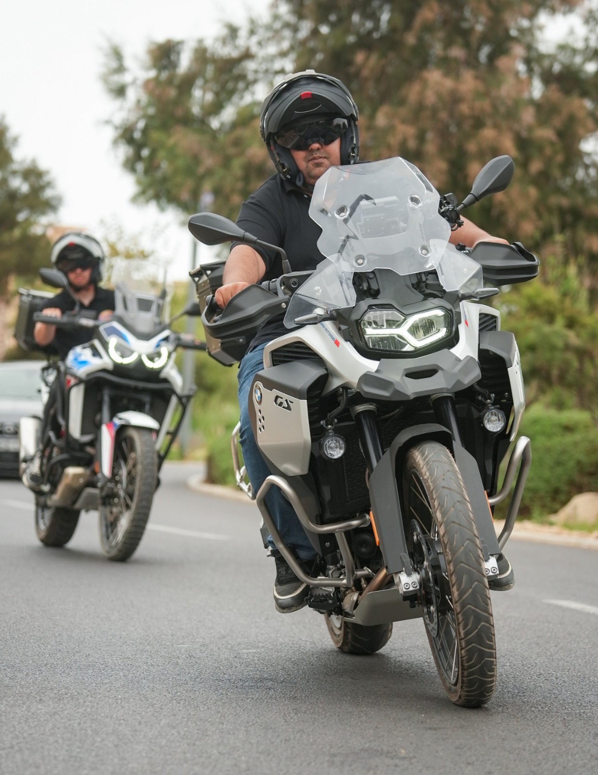 man riding motorcycle on brown sand
