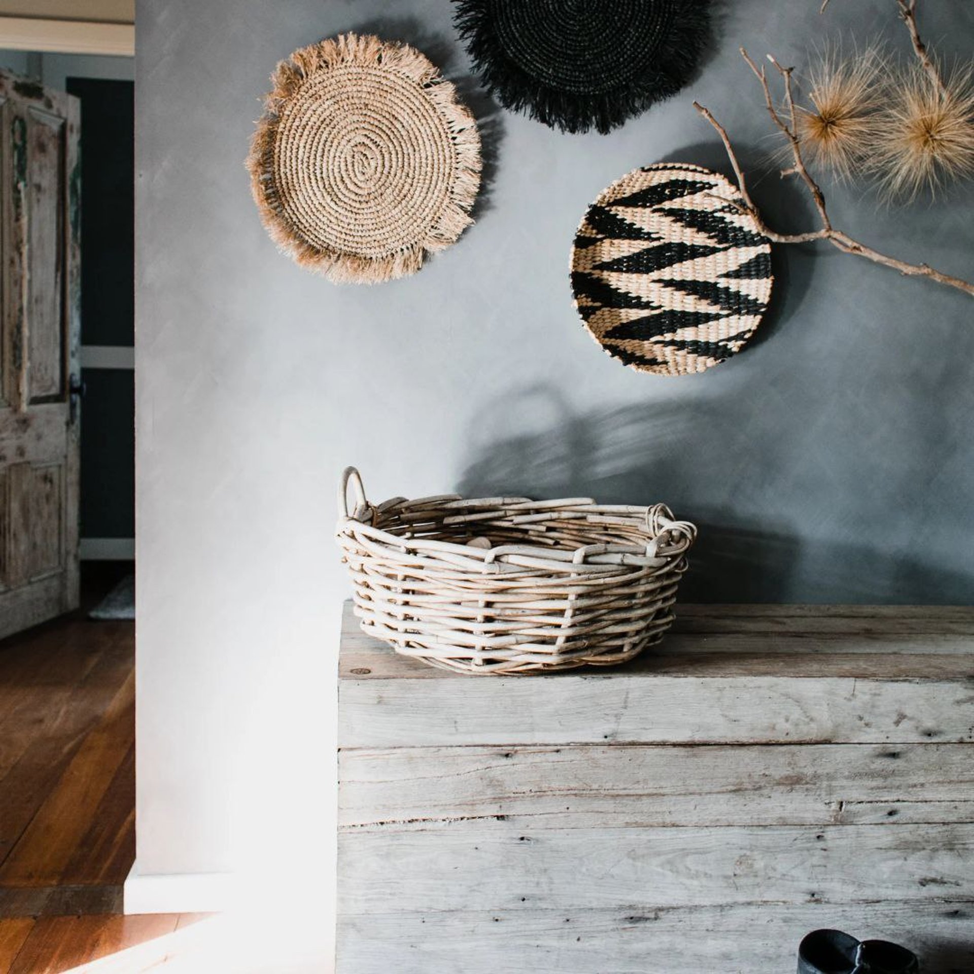 man in black t-shirt sitting on brown wooden chair