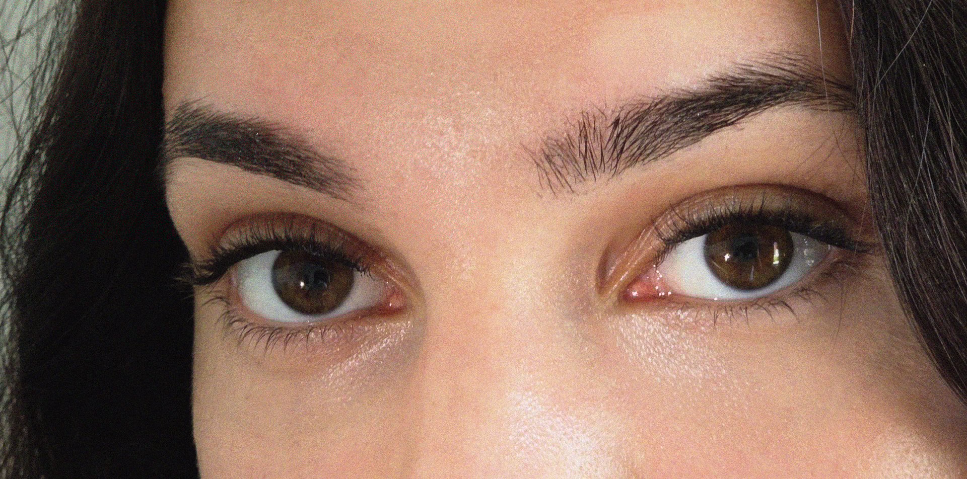 woman wearing red, white, and black aztec top