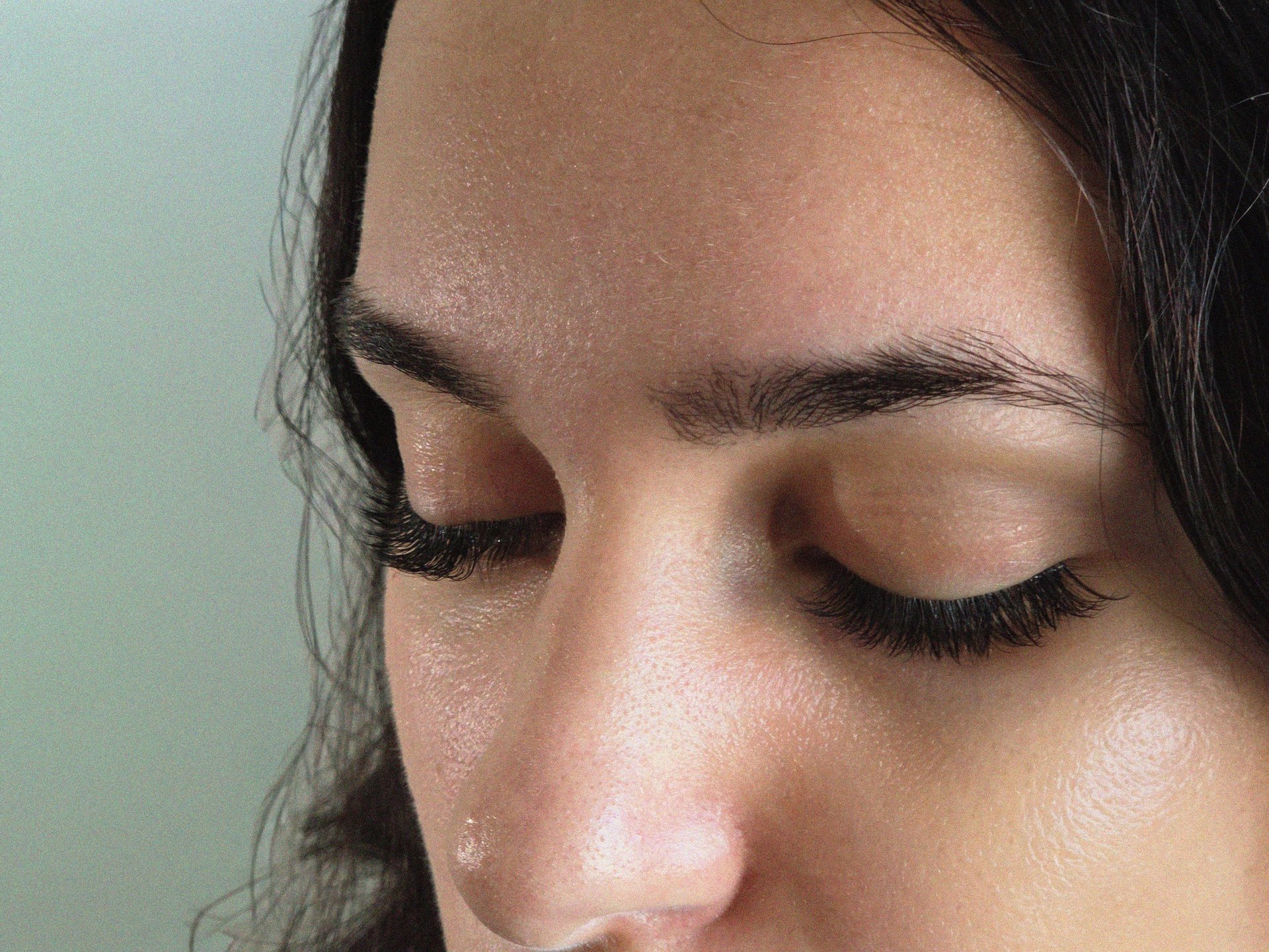woman with gold lipstick and orange and gray eyeshadow