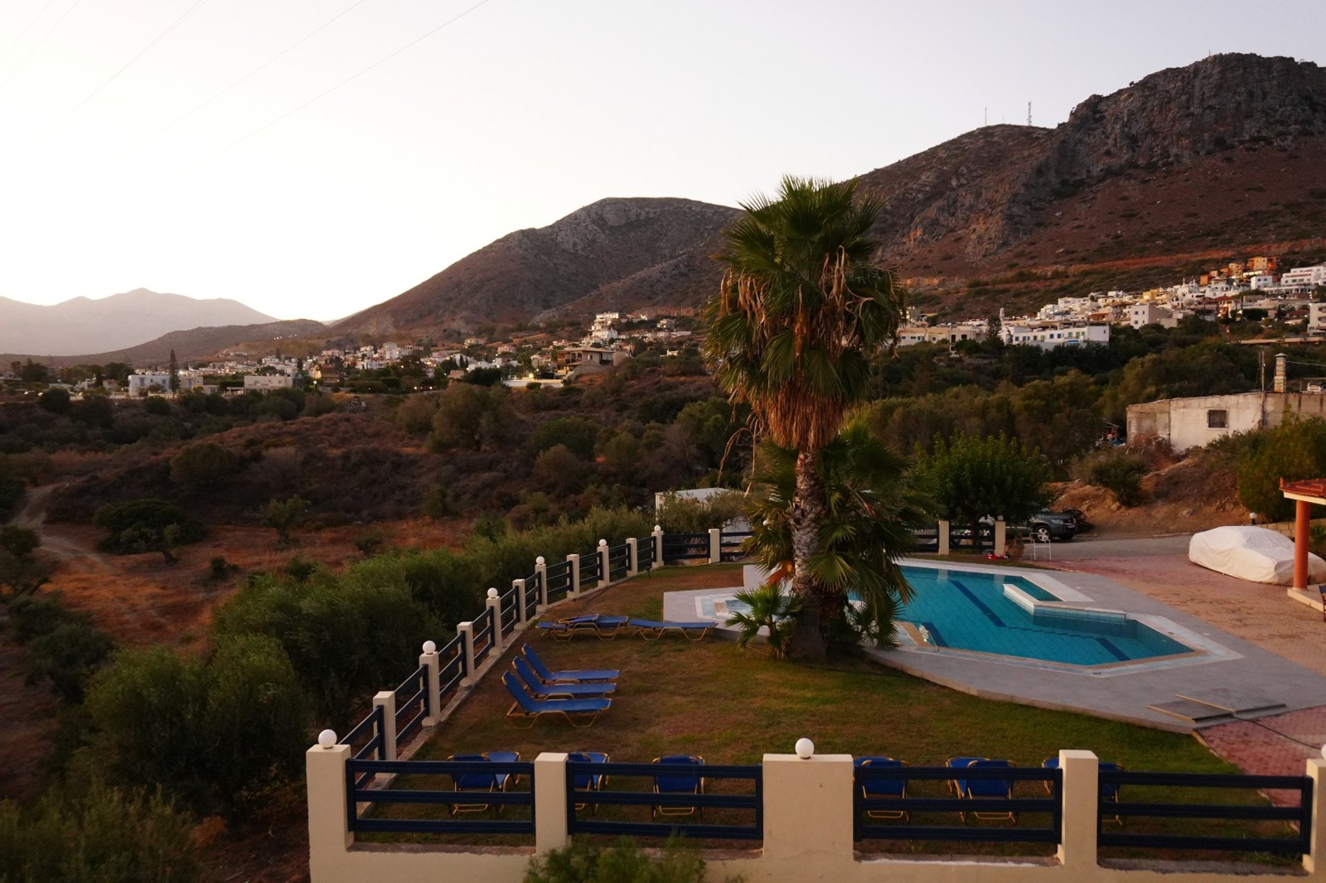 woman wearing yellow long-sleeved dress under white clouds and blue sky during daytime
