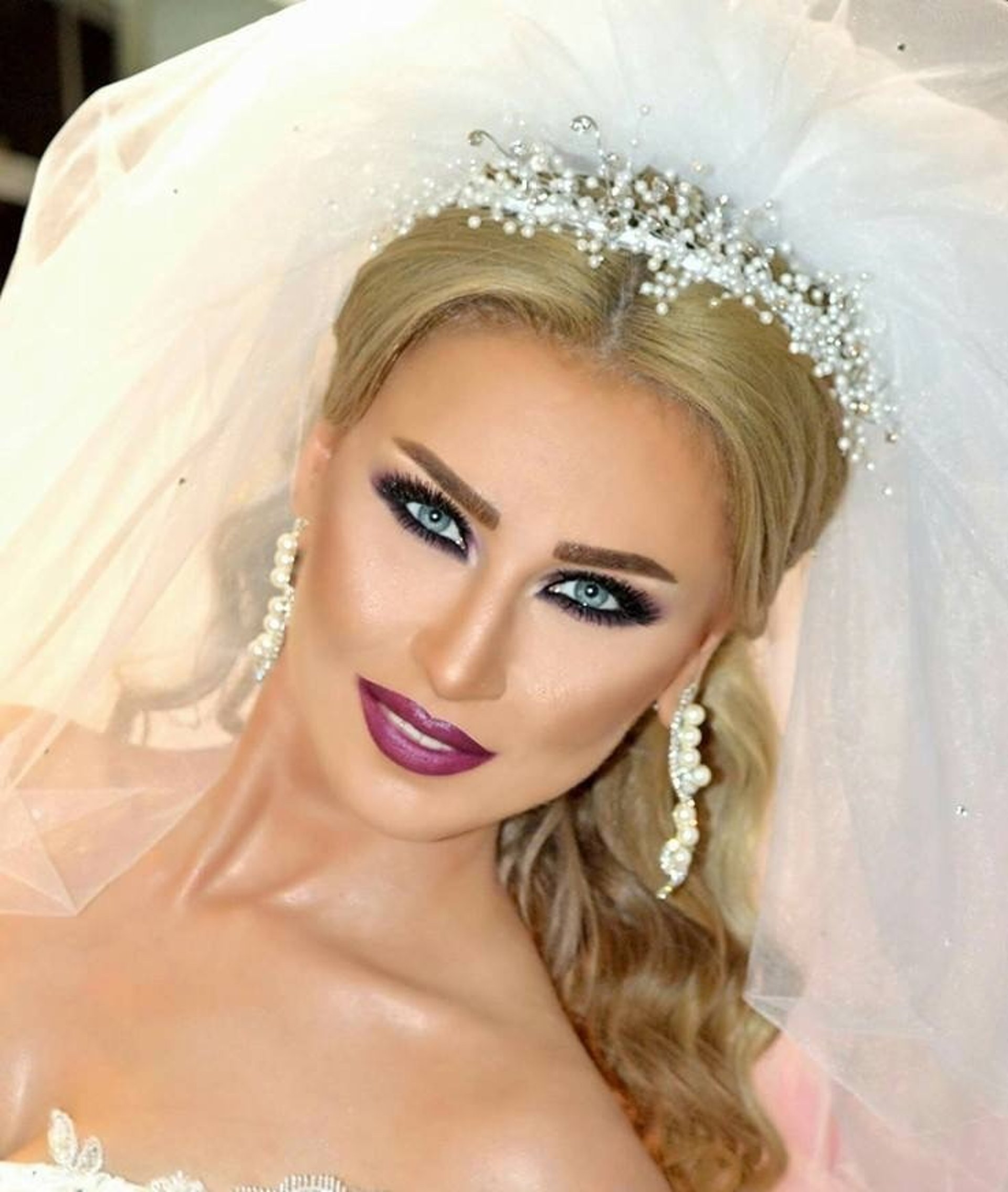 woman wearing yellow long-sleeved dress under white clouds and blue sky during daytime