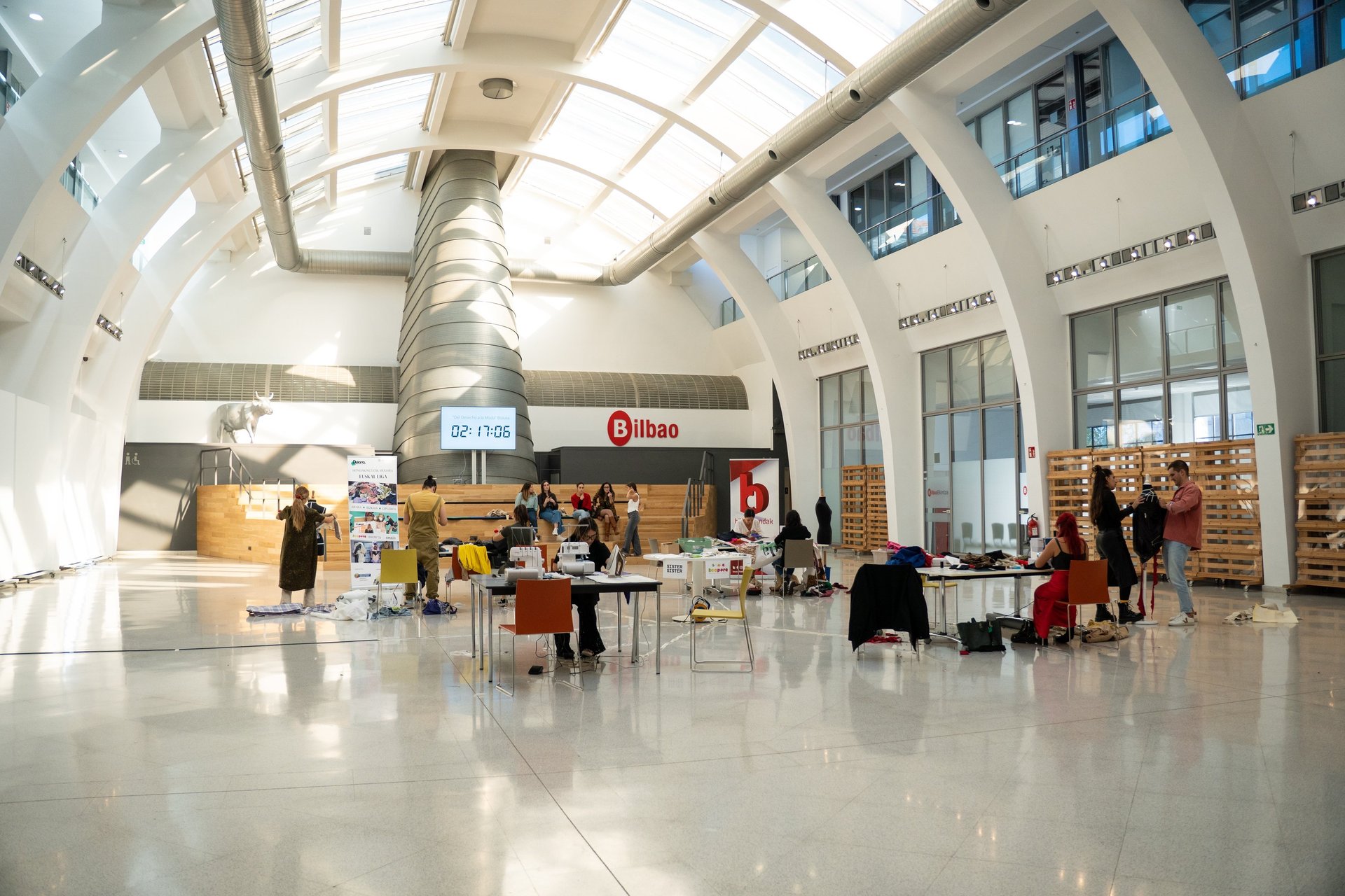 an abstract photo of a curved building with a blue sky in the background