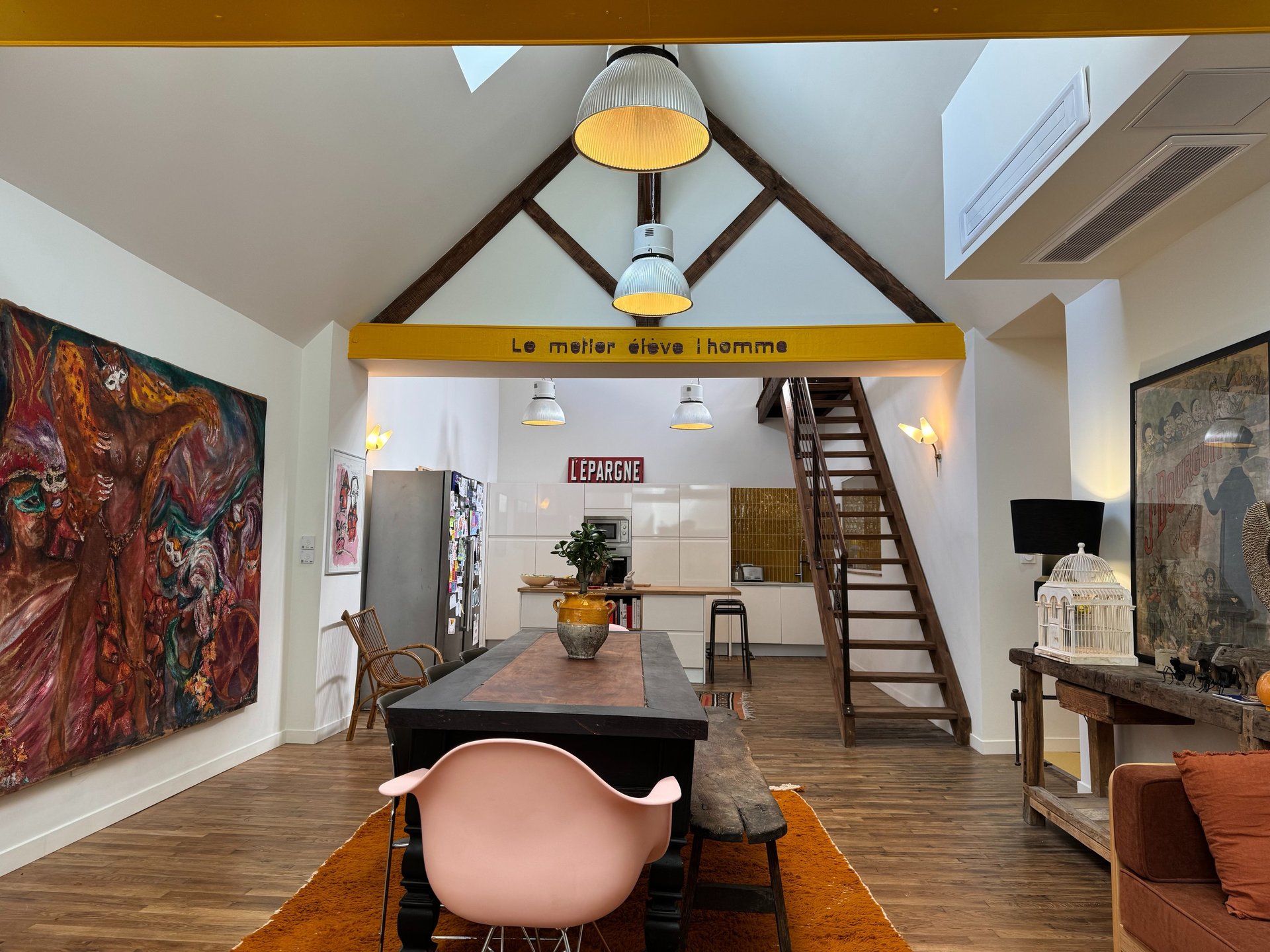 an abstract photo of a curved building with a blue sky in the background