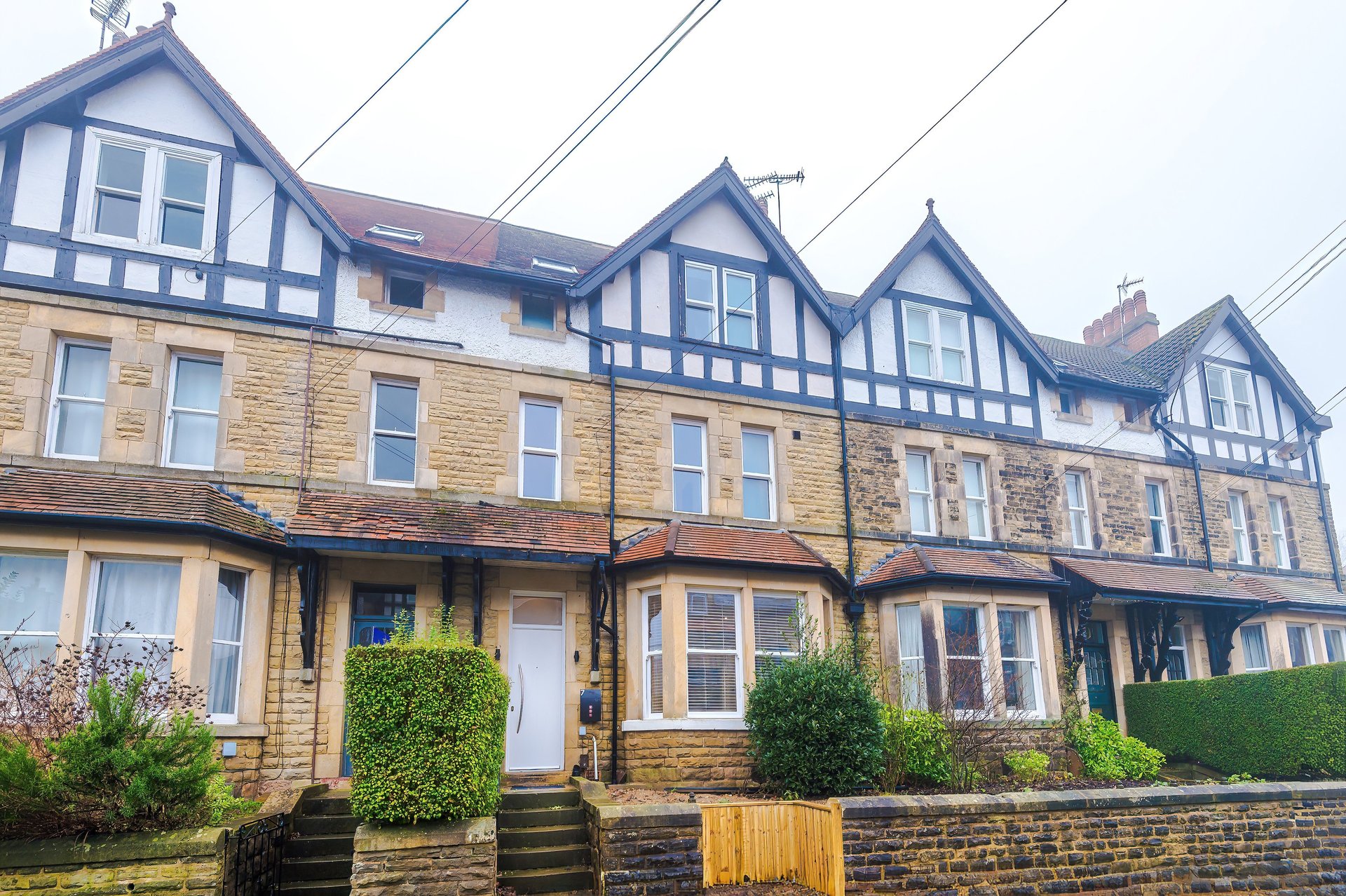 black and brown leather padded tub sofa
