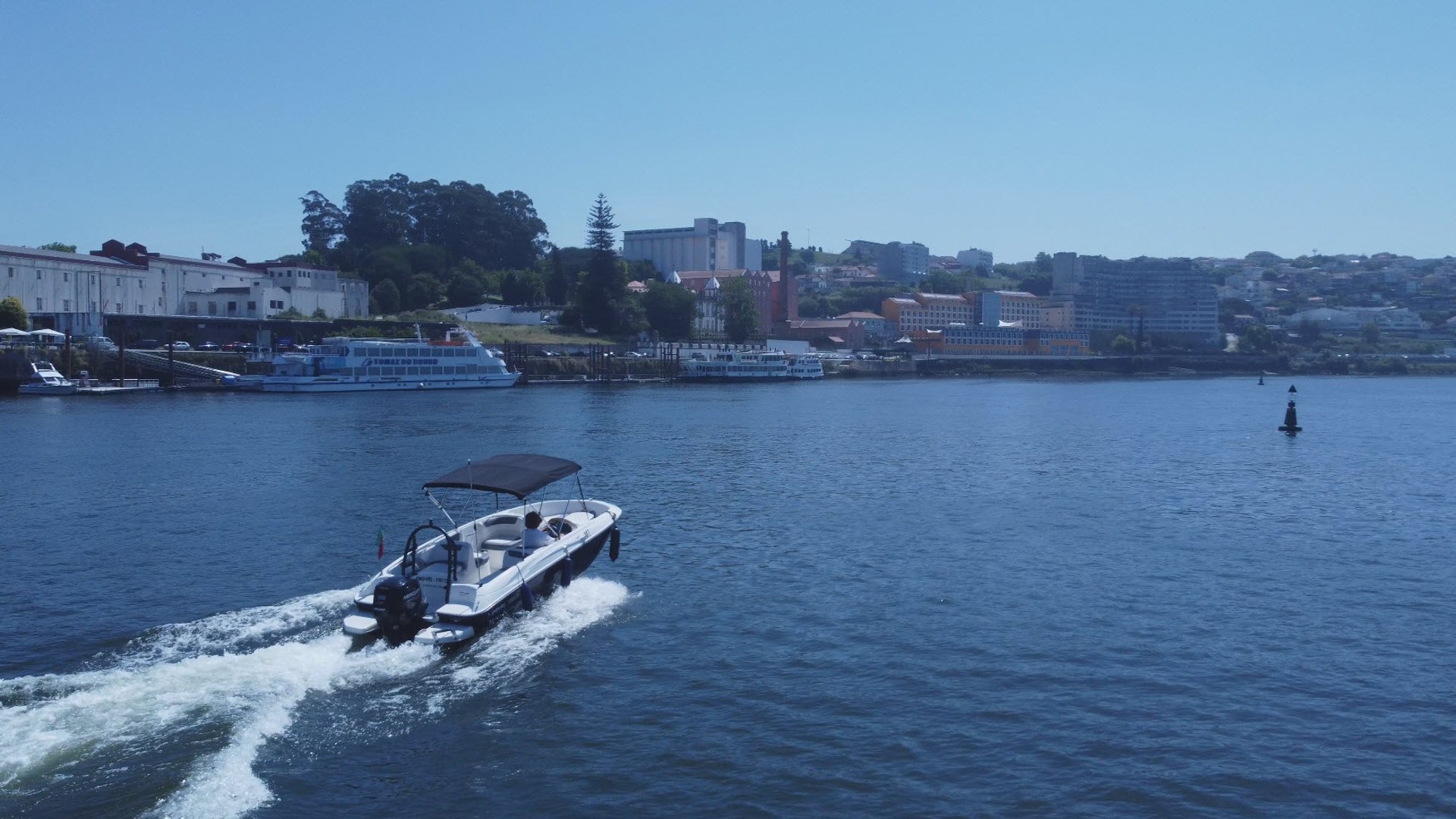 an abstract photo of a curved building with a blue sky in the background