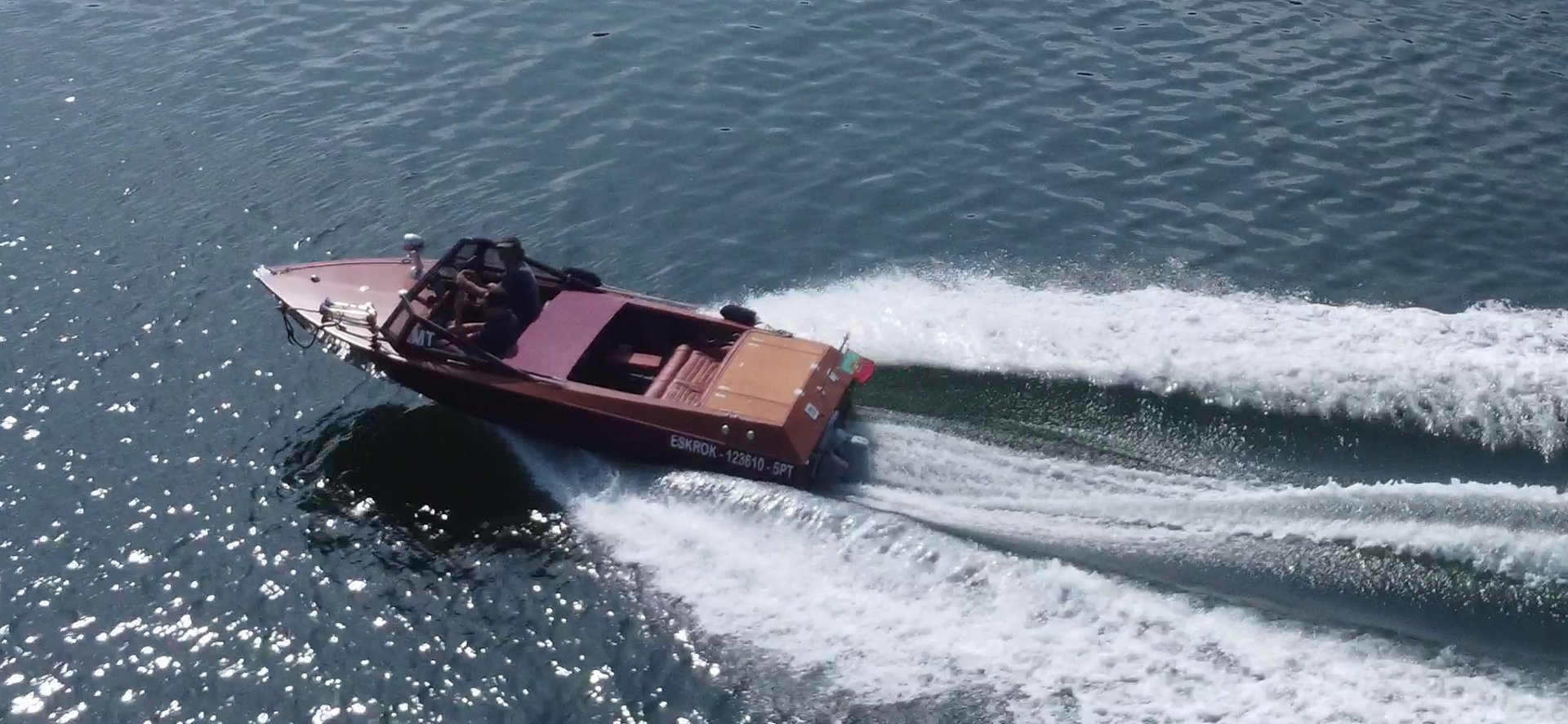 an abstract photo of a curved building with a blue sky in the background