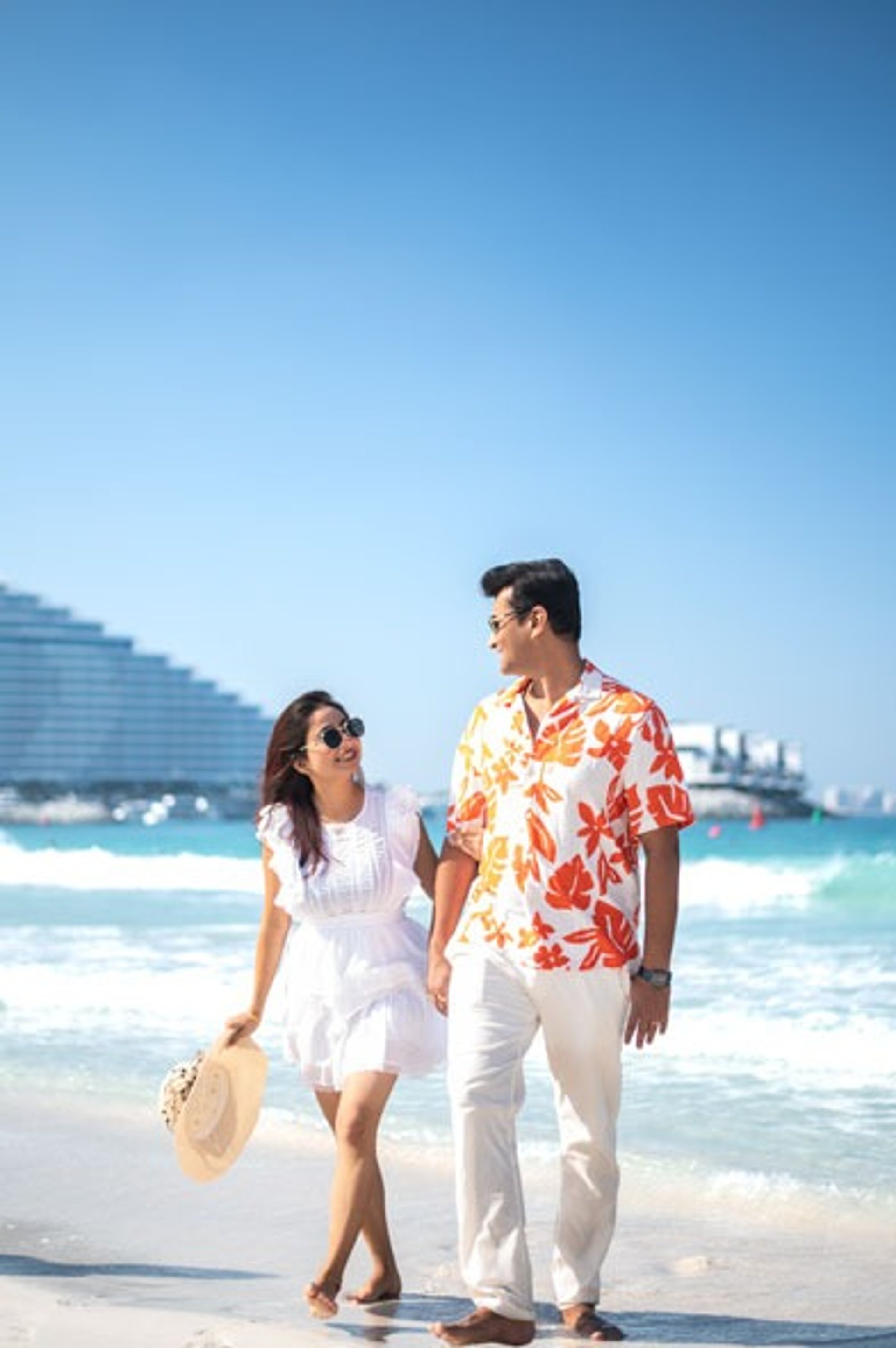 woman wearing yellow long-sleeved dress under white clouds and blue sky during daytime