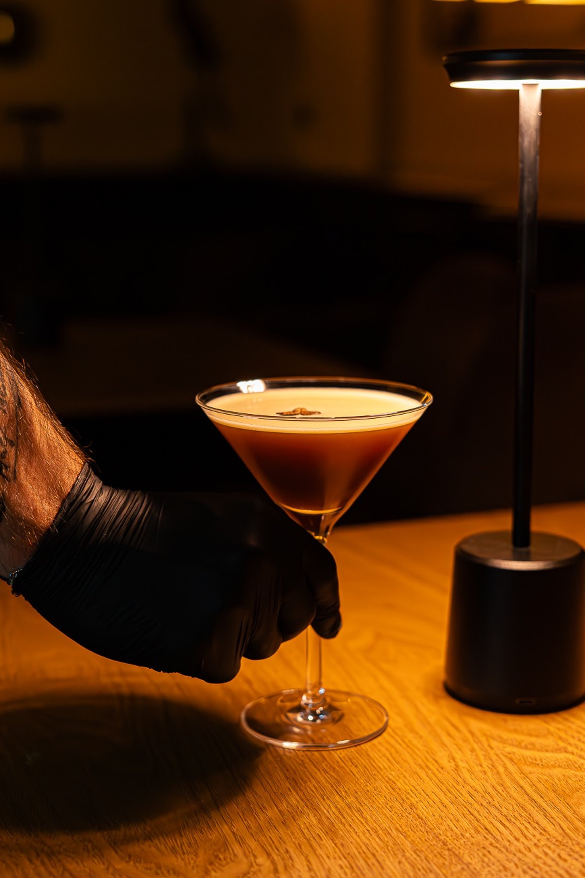 person taking picture inside of restaurant