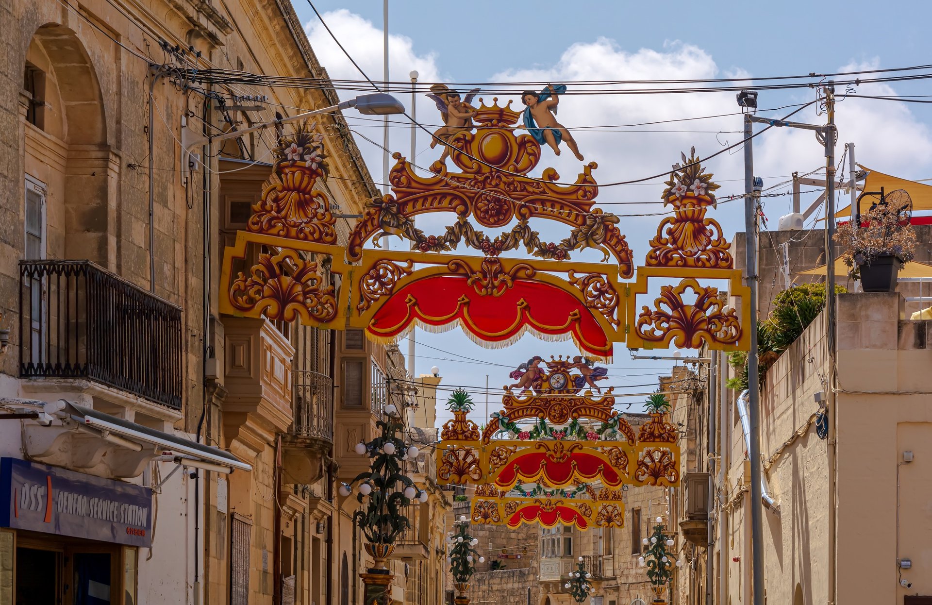 Colour banners, traditional Pavaljuni, strung across the streets of Xaghra ready for the annual village celebration.