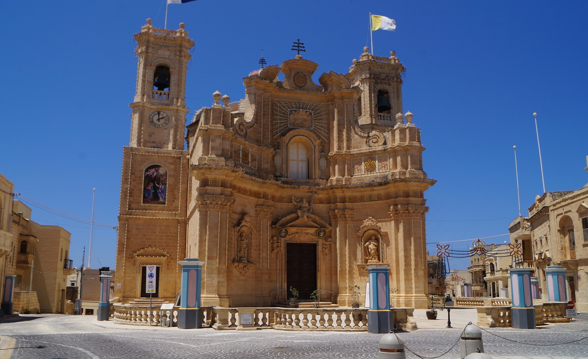 Baroque style Catholic Church against a blue sky. 