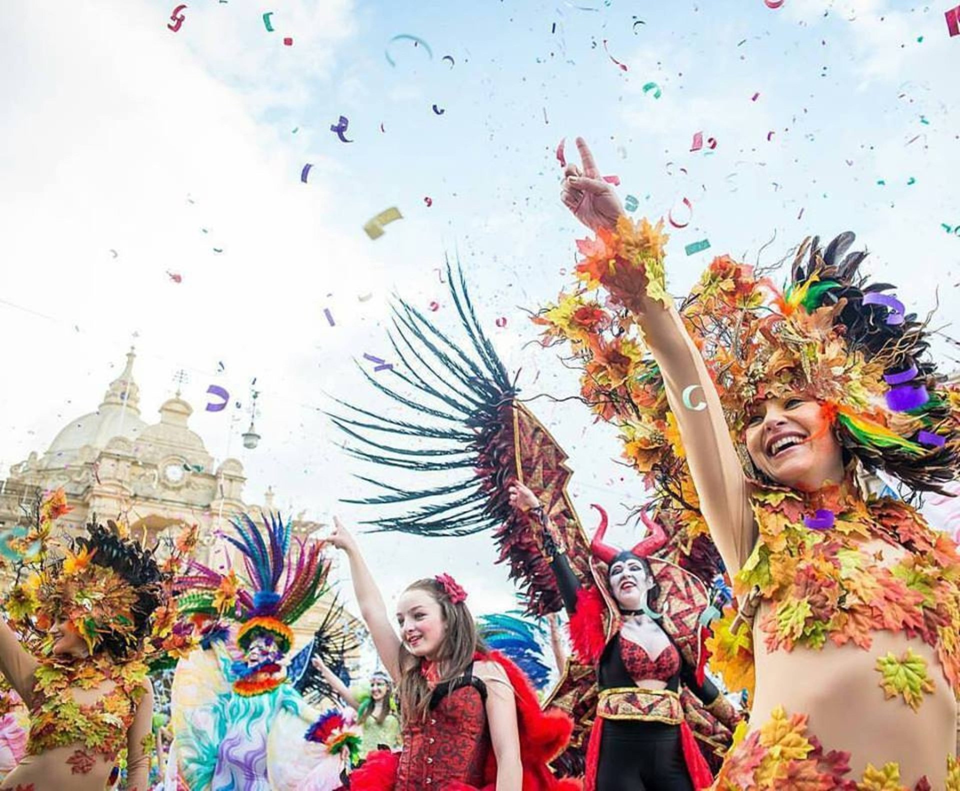 Carnival dancers in front of a church. 