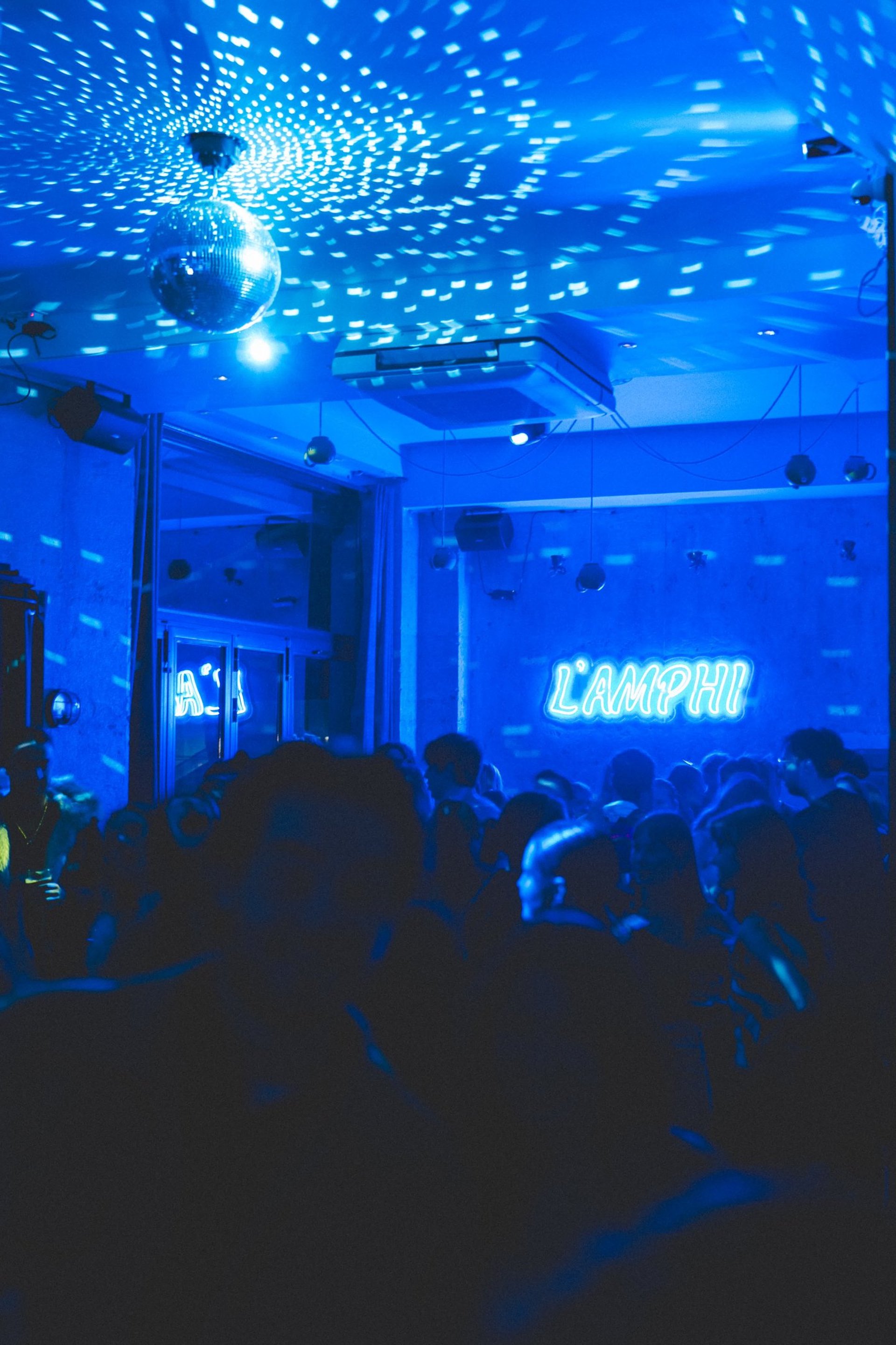 an abstract photo of a curved building with a blue sky in the background