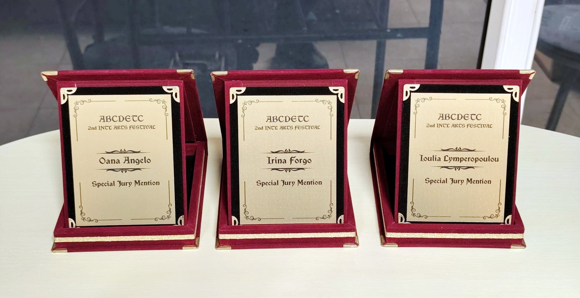 a row of yellow stars sitting on top of a blue and pink surface