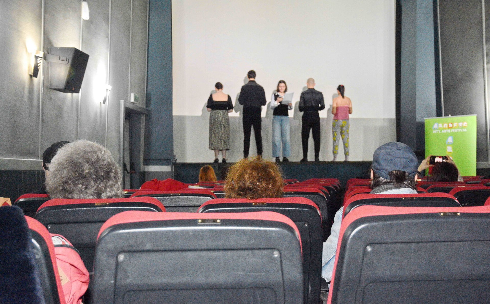 fountain pen on black lined paper