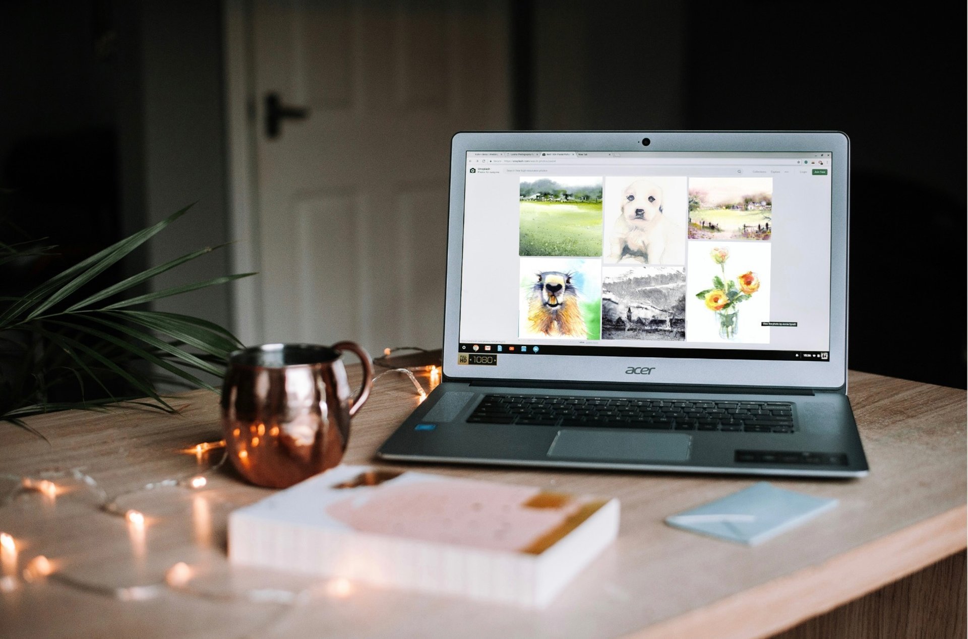 girl wearing grey long-sleeved shirt using MacBook Pro on brown wooden table