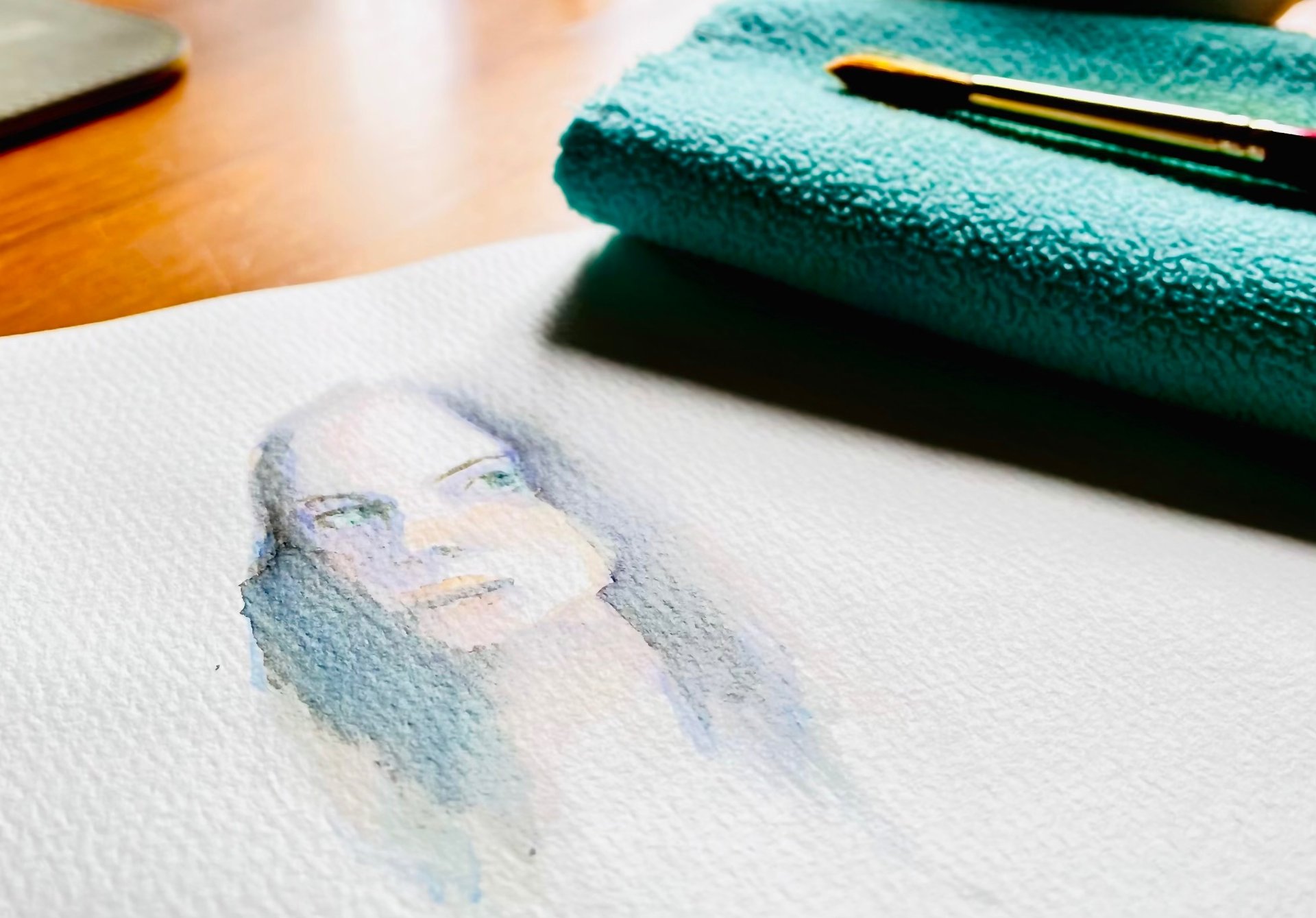 person holding ballpoint pen writing on notebook