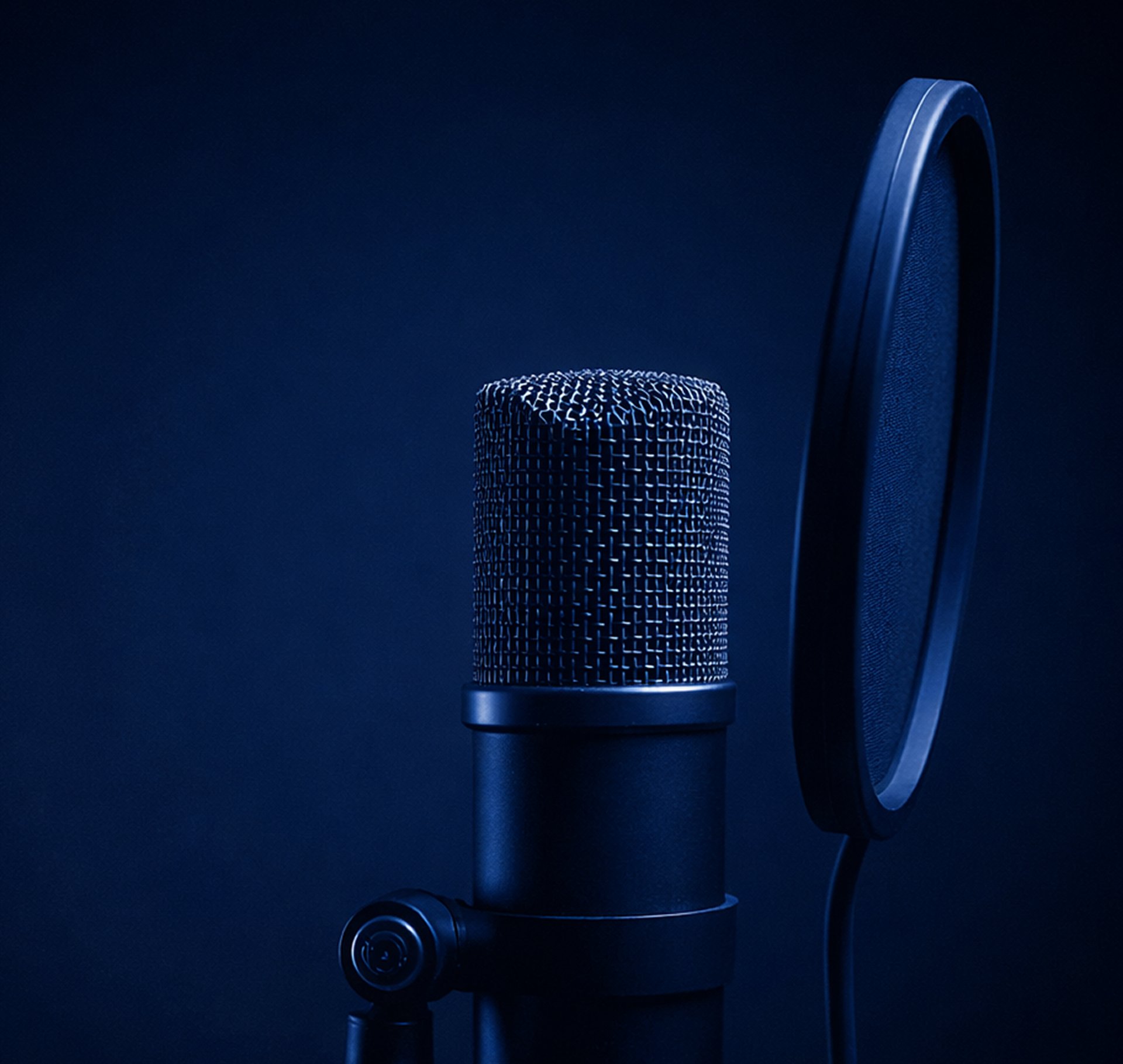 four men sitting beside table
