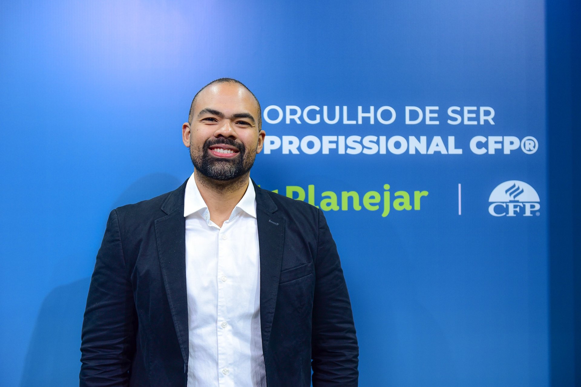an abstract photo of a curved building with a blue sky in the background