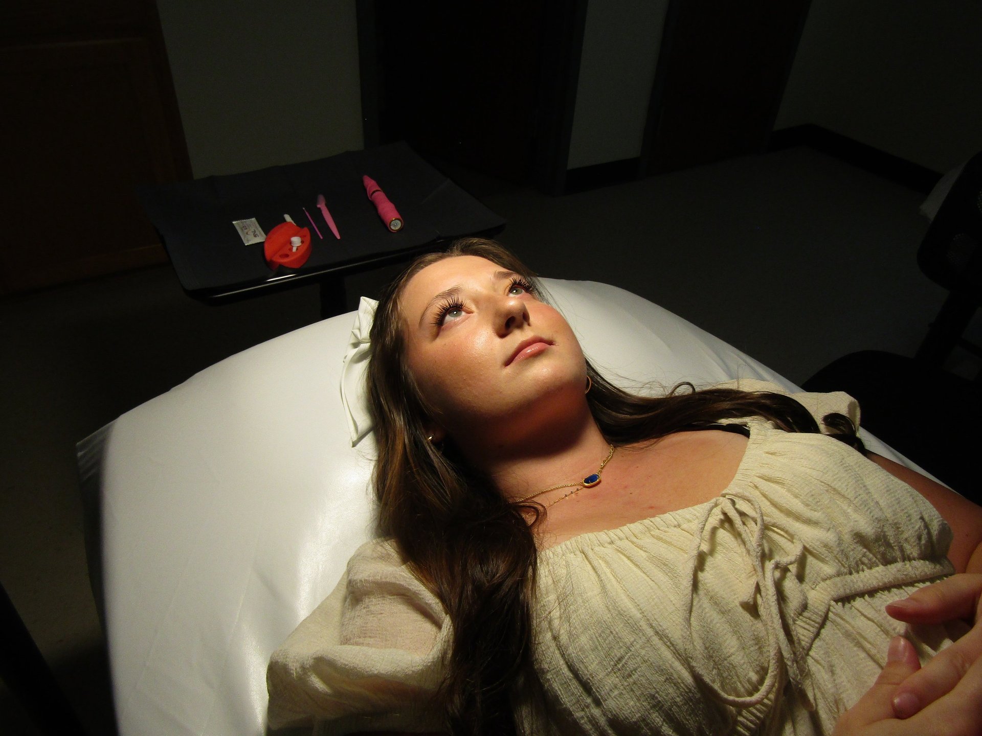 woman and man near white wall